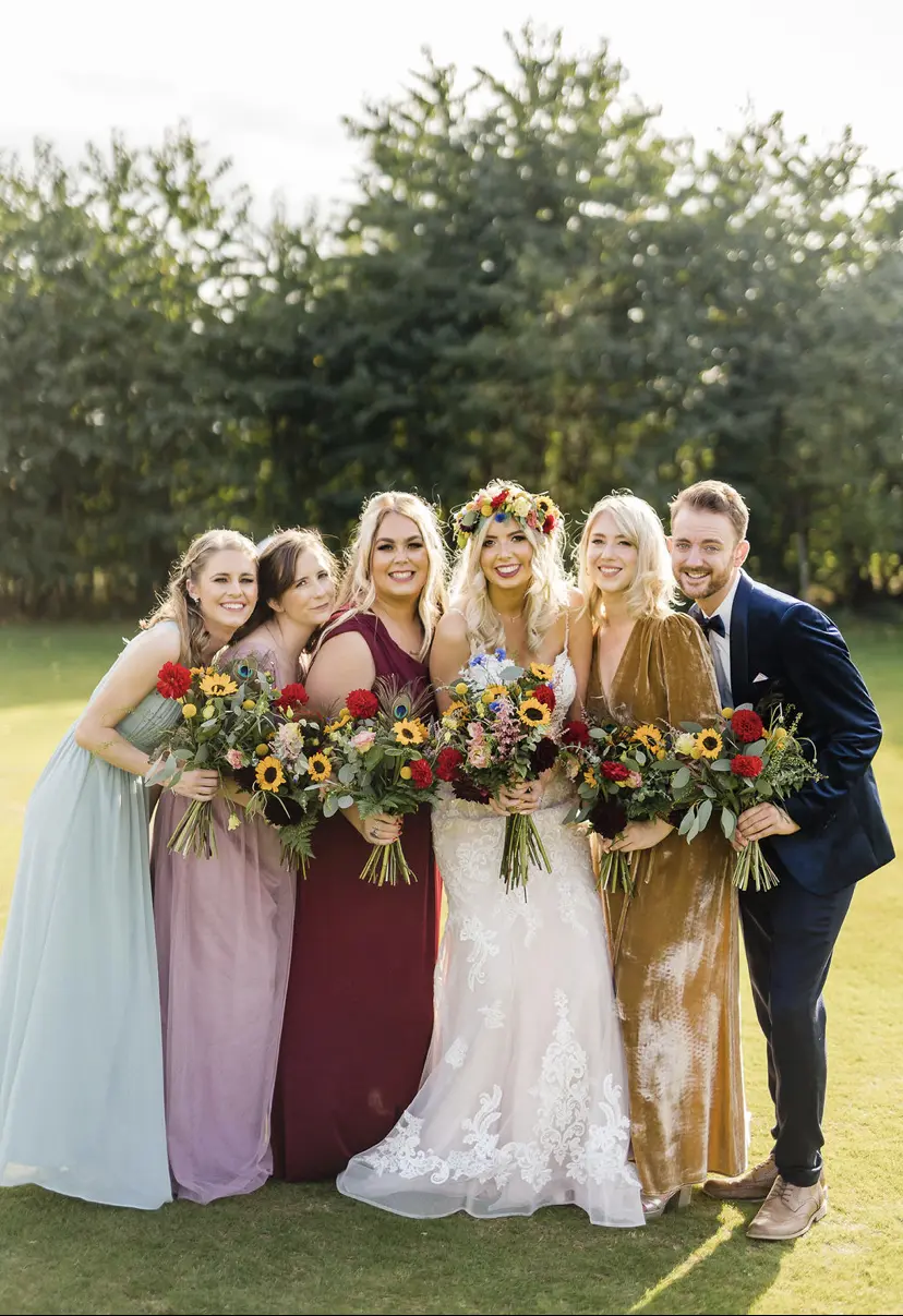 Wedding Party and Bride Wearing Elegant Fit-and-Flare Bridal Dress by Maggie Sottero
