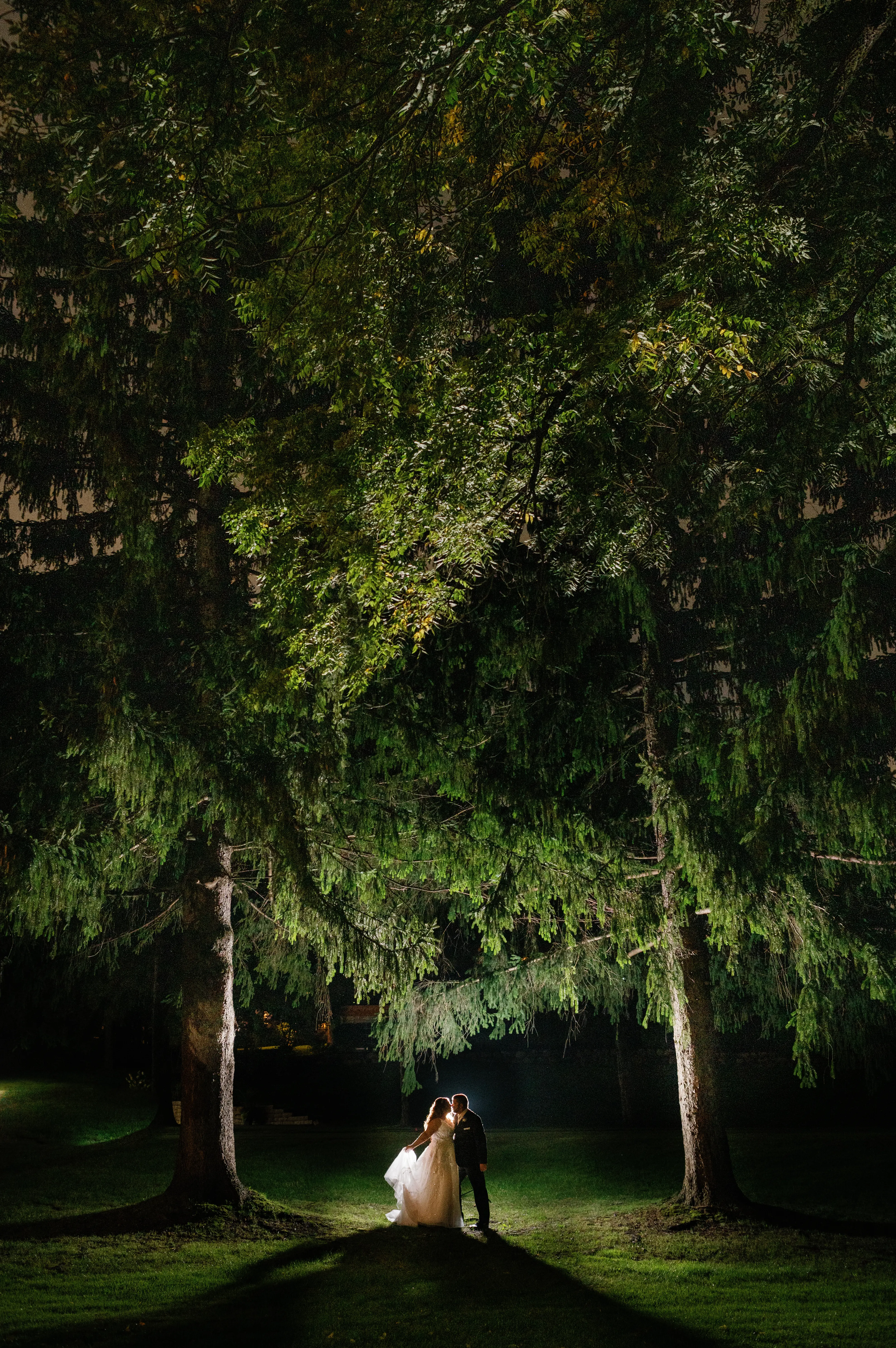 Bride Wearing Beaded Wedding Dress Called Marvine By Sottero And Midgley With Groom In A Park At Night