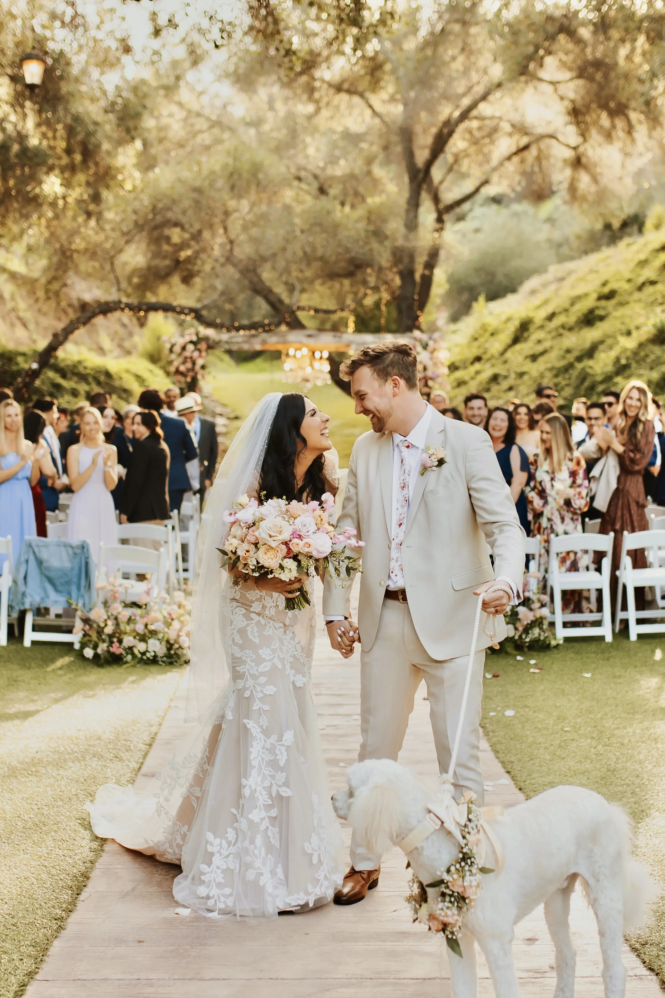 Bride In Cottagecore Lace Wedding Dress Called Ivy By Maggie Sottero With Groom And Dog At Wedding Ceremony