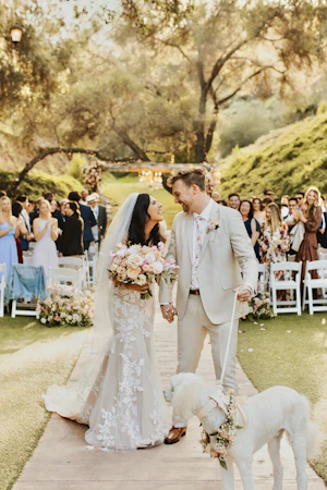 Bride In Cottagecore Lace Wedding Dress Called Ivy By Maggie Sottero With Groom And Dog At Wedding Ceremony