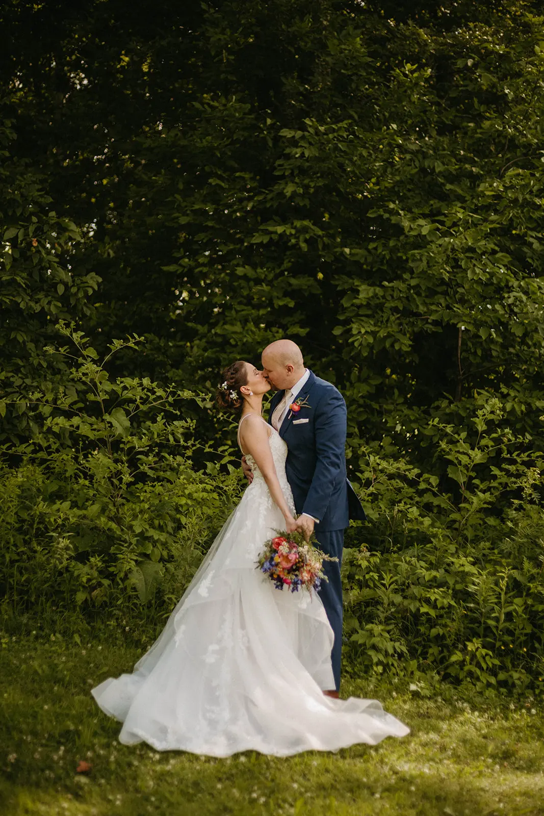Bride In Floral Lace Bridal Gown Named Lettie By Rebecca Ingram Bride And Groom Kissing