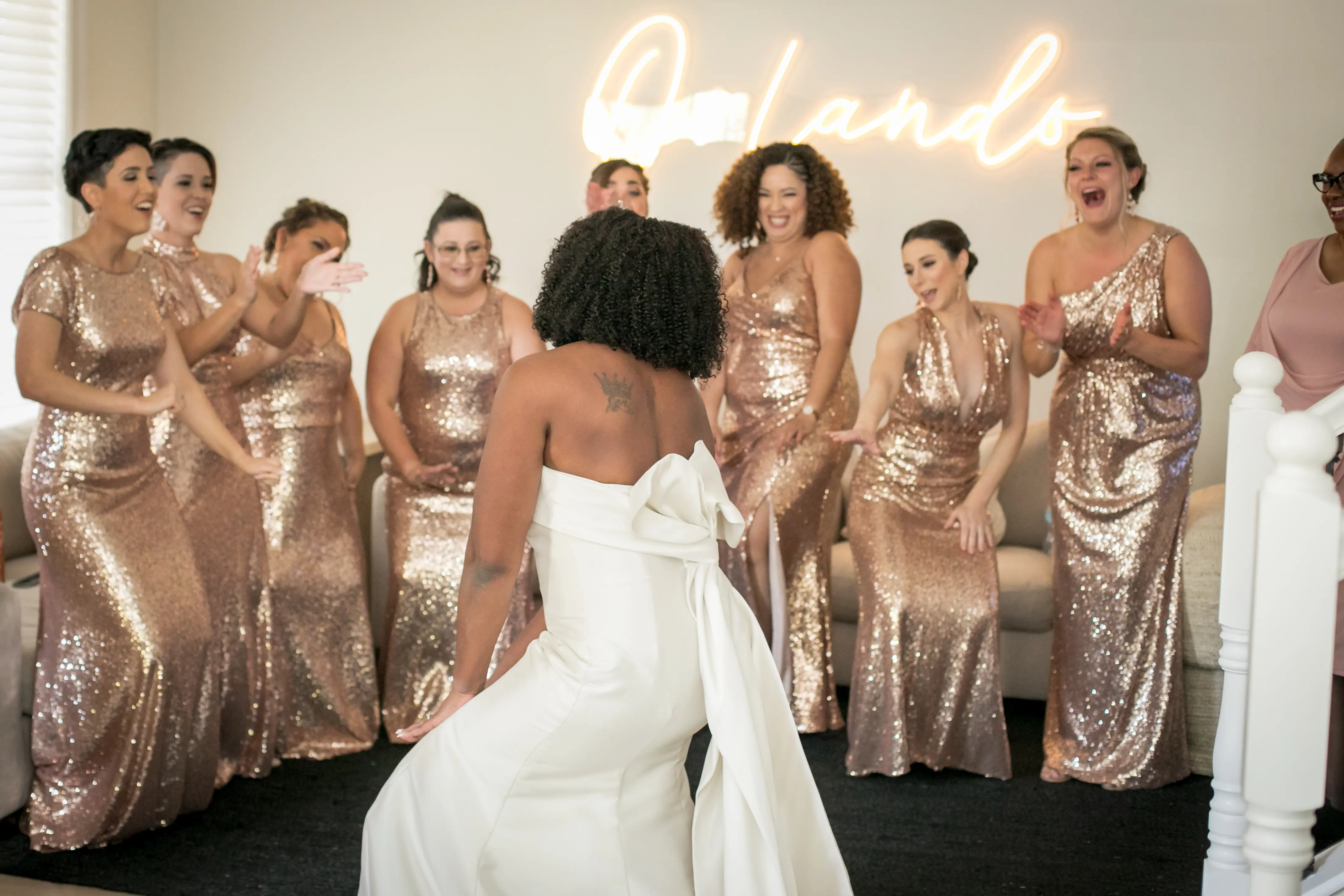 Bridesmaids Cheering For Bride is Strapless Satin Dress With Bow Named Mitchell By Maggie Sottero