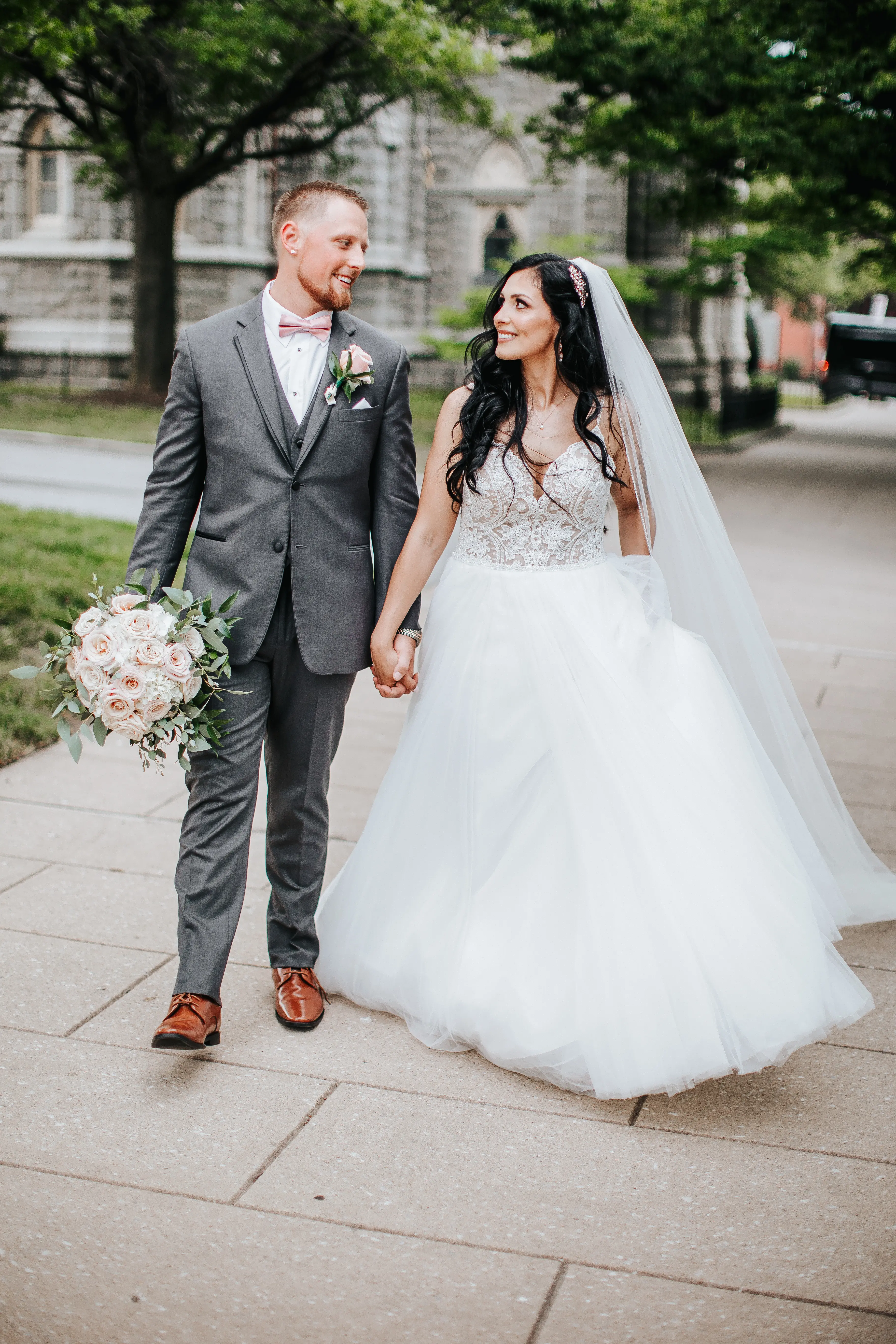 Bride with groom wearing boho princess wedding dress