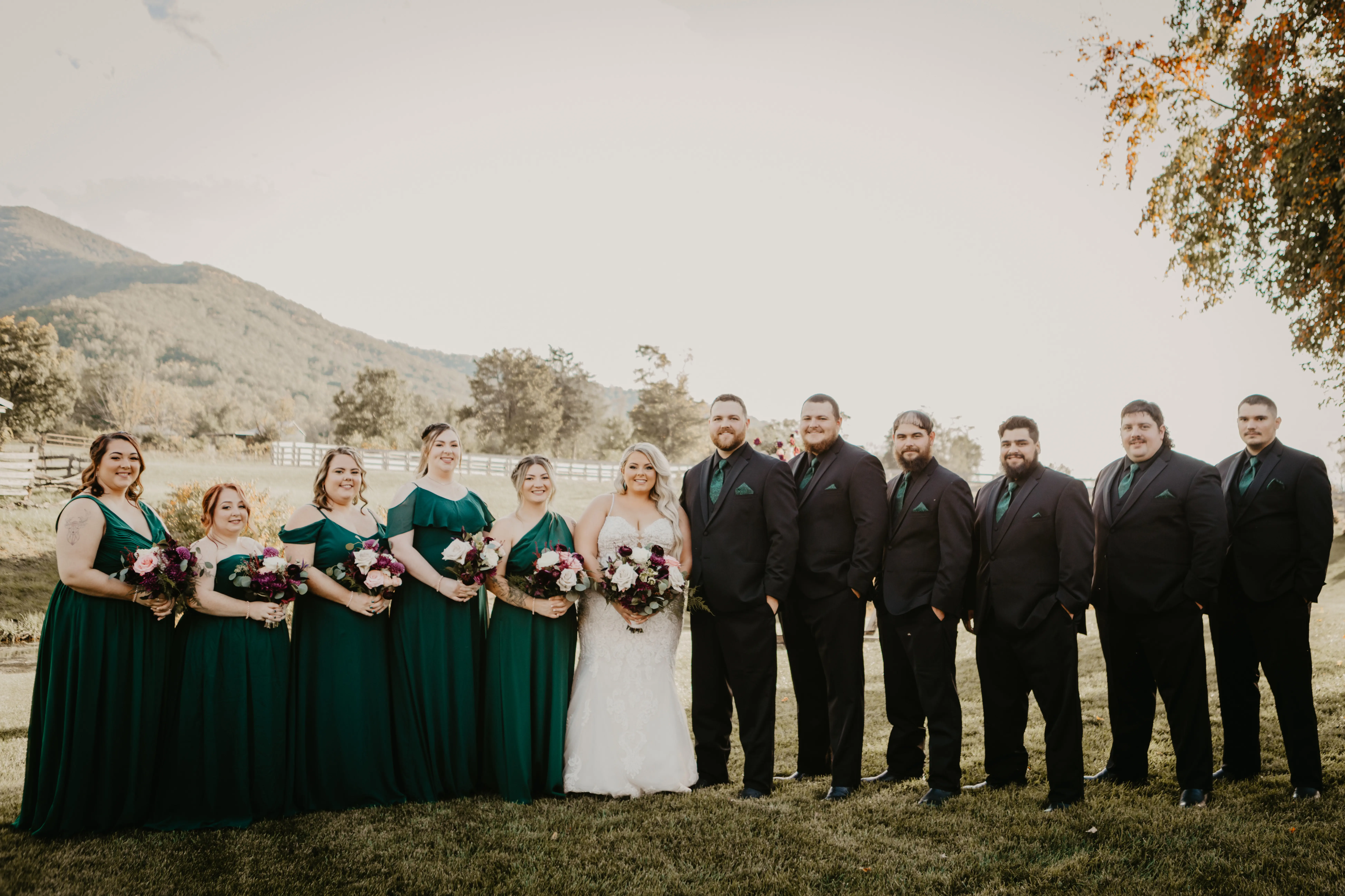 Bride wearing Fiona wedding gown by Maggie Sottero with her groom and bridal party