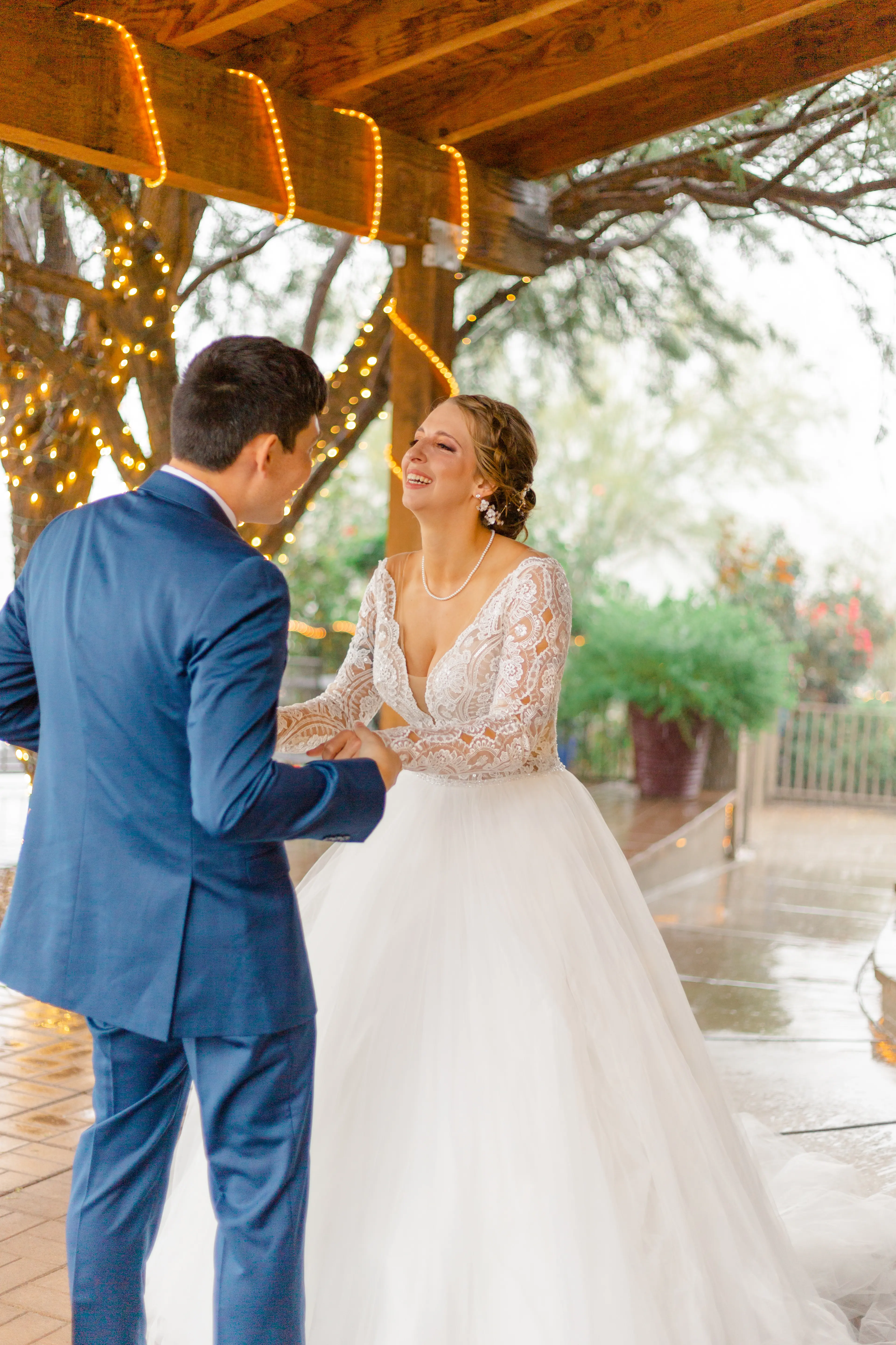 Groom Dancing with Bride in Romantic Long Sleeve Ball Gown Wedding Dress with Lace Motifs on Nude Bodice and Tulle Skirt Called Mallory Dawn by Maggie Sottero