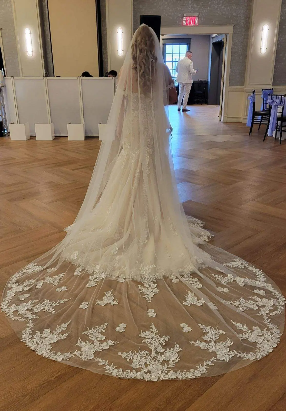 Bride wearing Lennon by Maggie Sottero showing off her veil