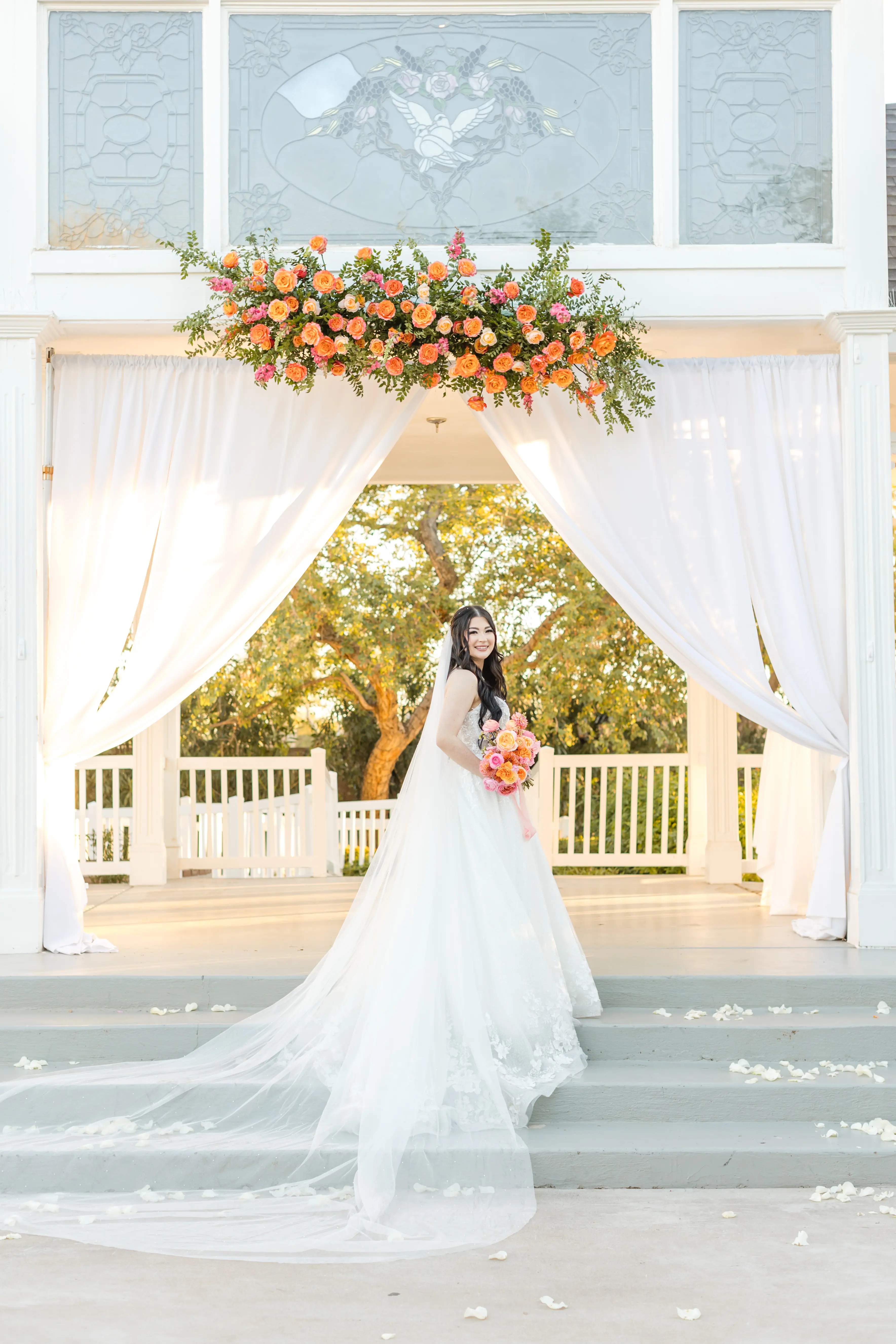 Bride wearing Casey by Maggie Sottero in front of her venue