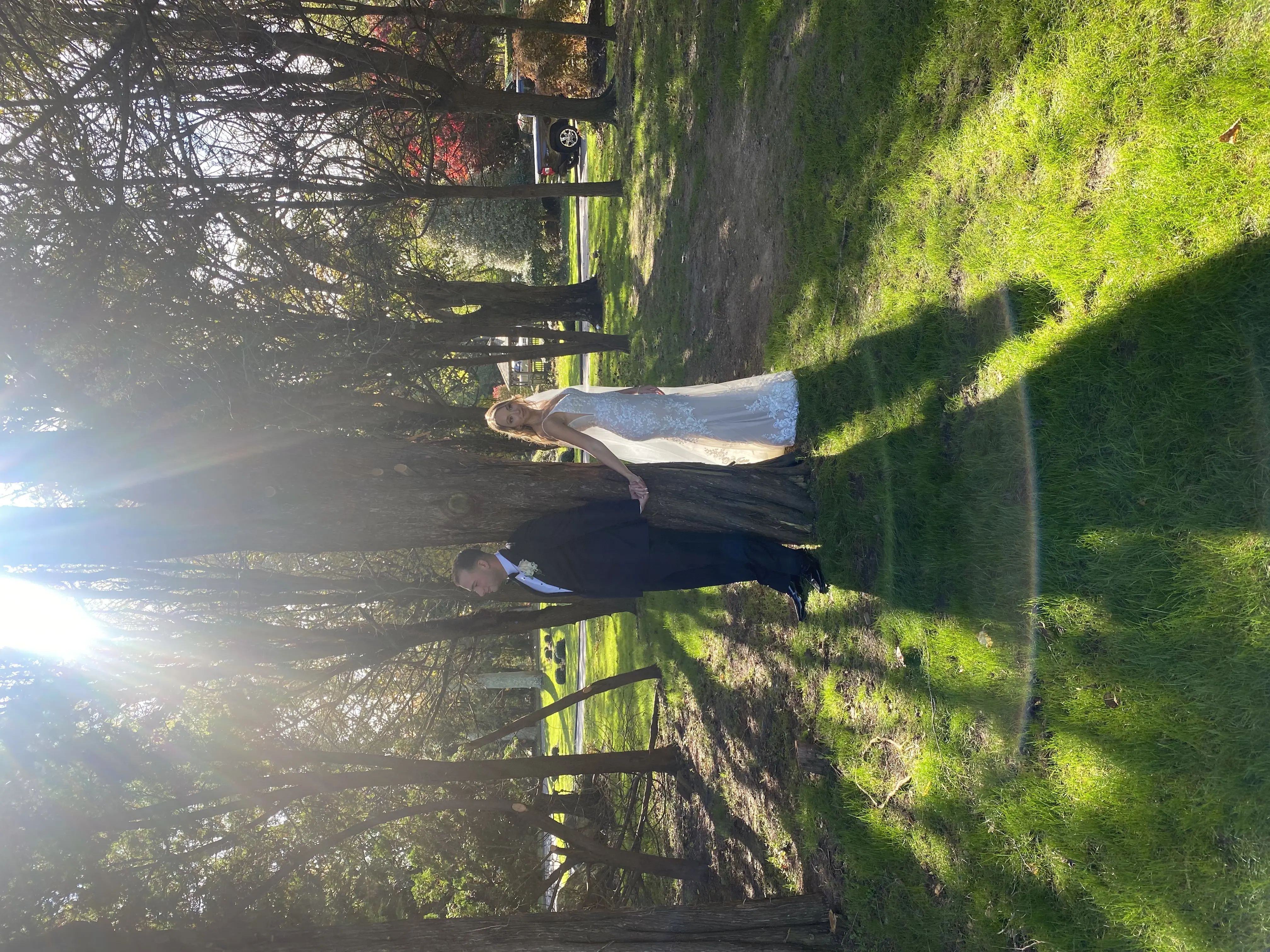 Real bride in sparkly lace fit-and-flare bridal gown with lace motifs over tulle called Fontaine by Maggie Sottero