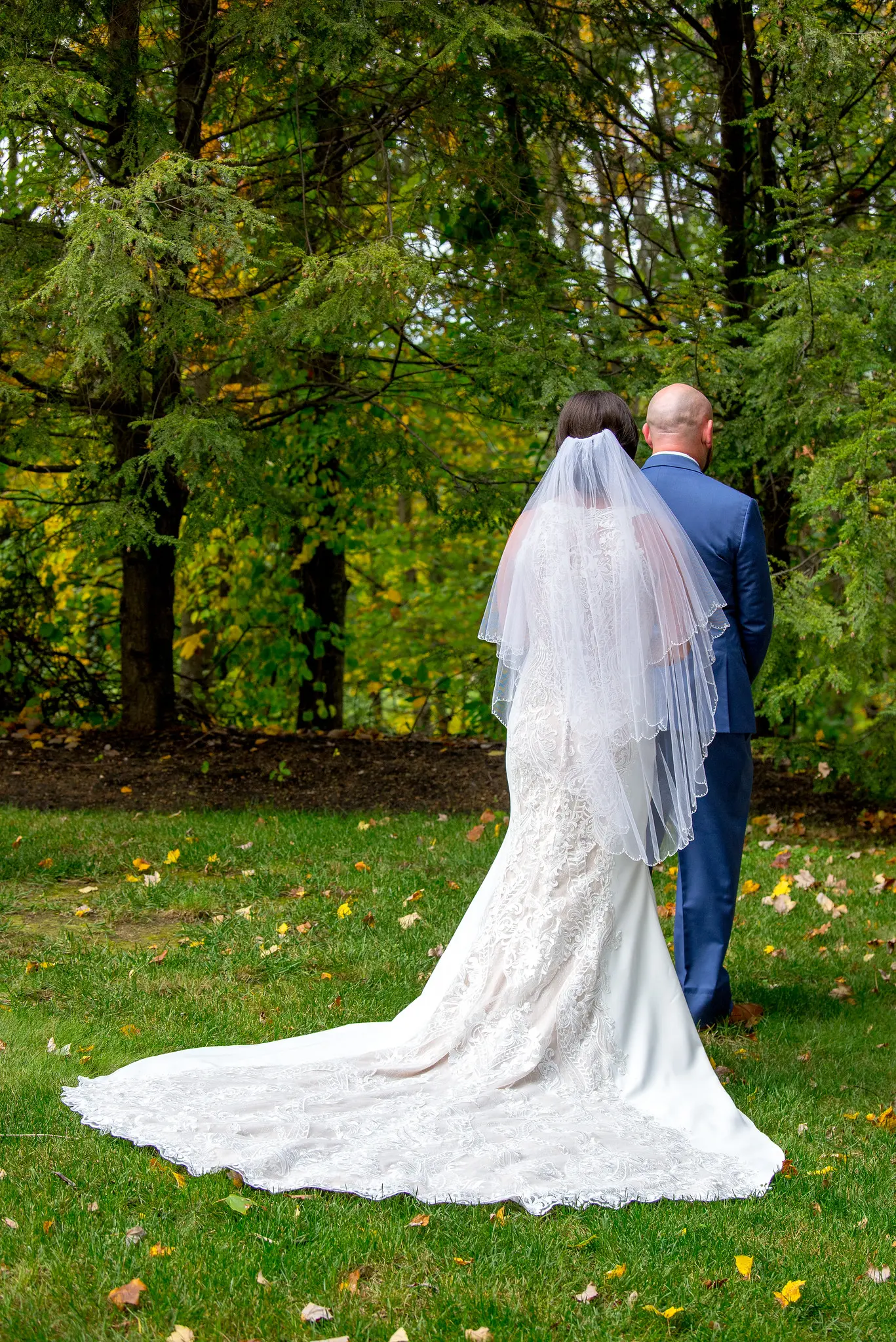 Bride wearing Lace Sheath Wedding Dress called Kevyn by Sottero and Midgley first look with her groom