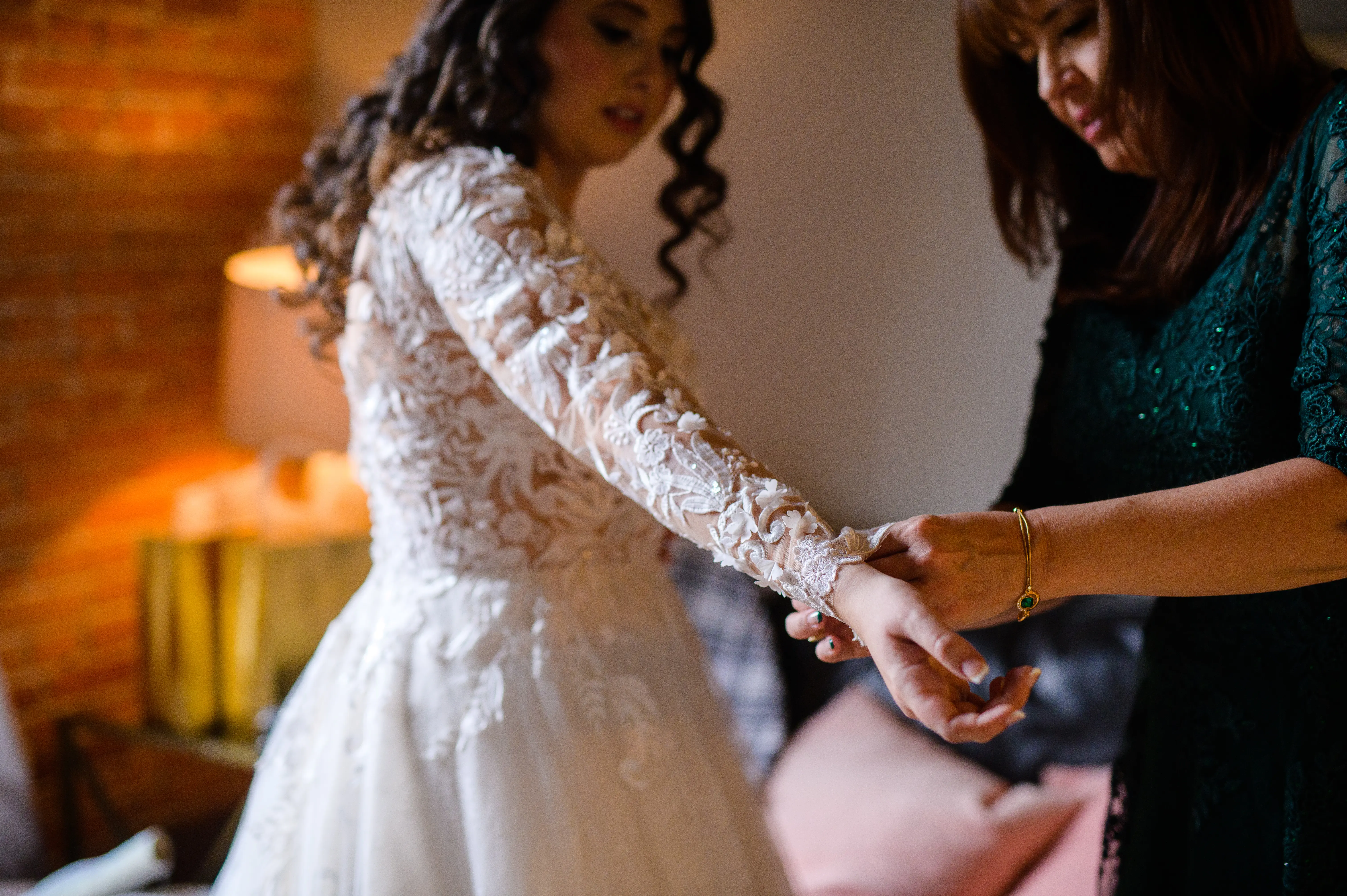 Bride Getting Ready Wearing Lace Long Sleeve Wedding Dress Called Zander By Sottero And Midgley