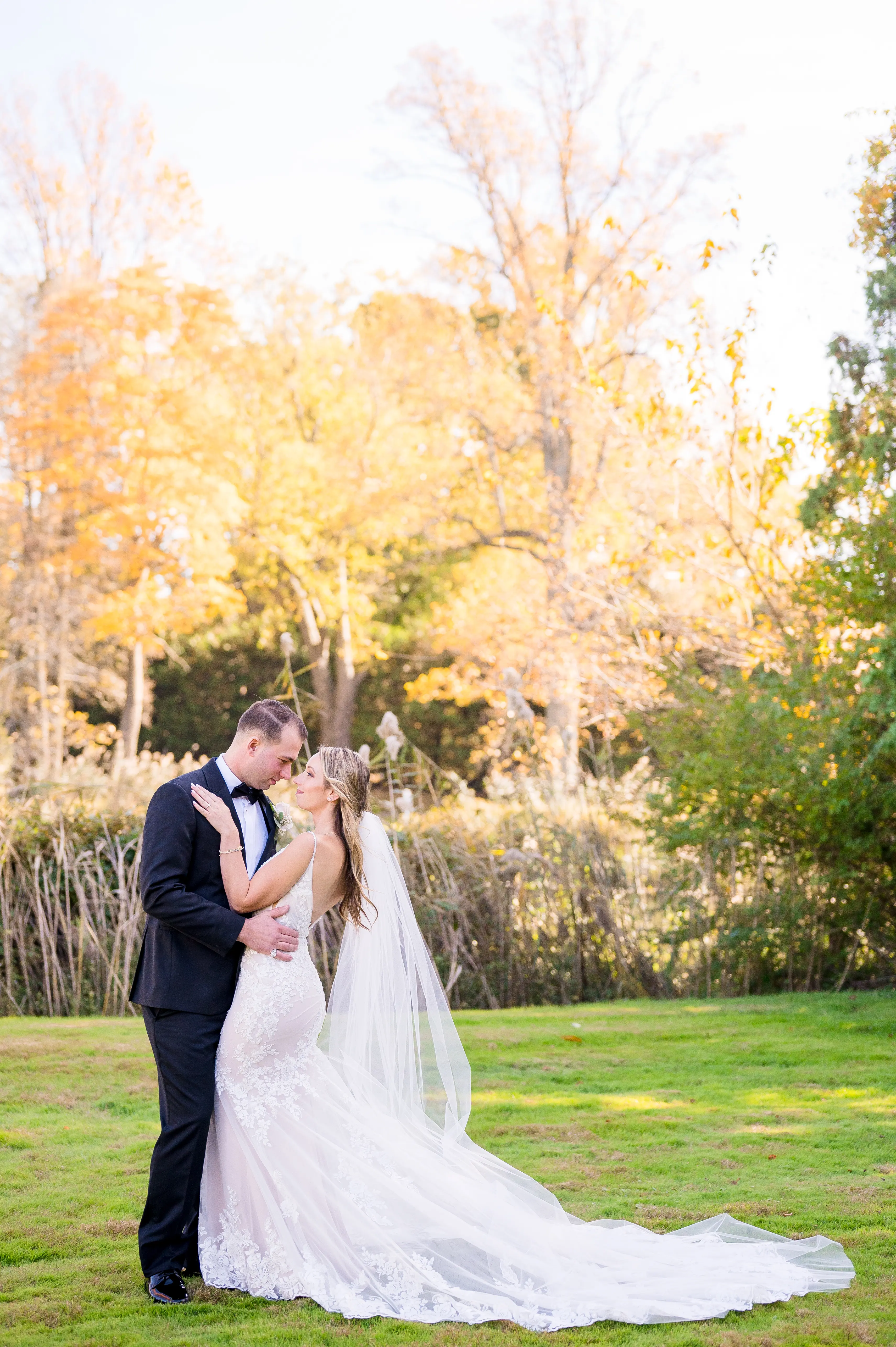 Real bride in sparkly lace fit-and-flare bridal gown with lace motifs over tulle called Fontaine by Maggie Sottero