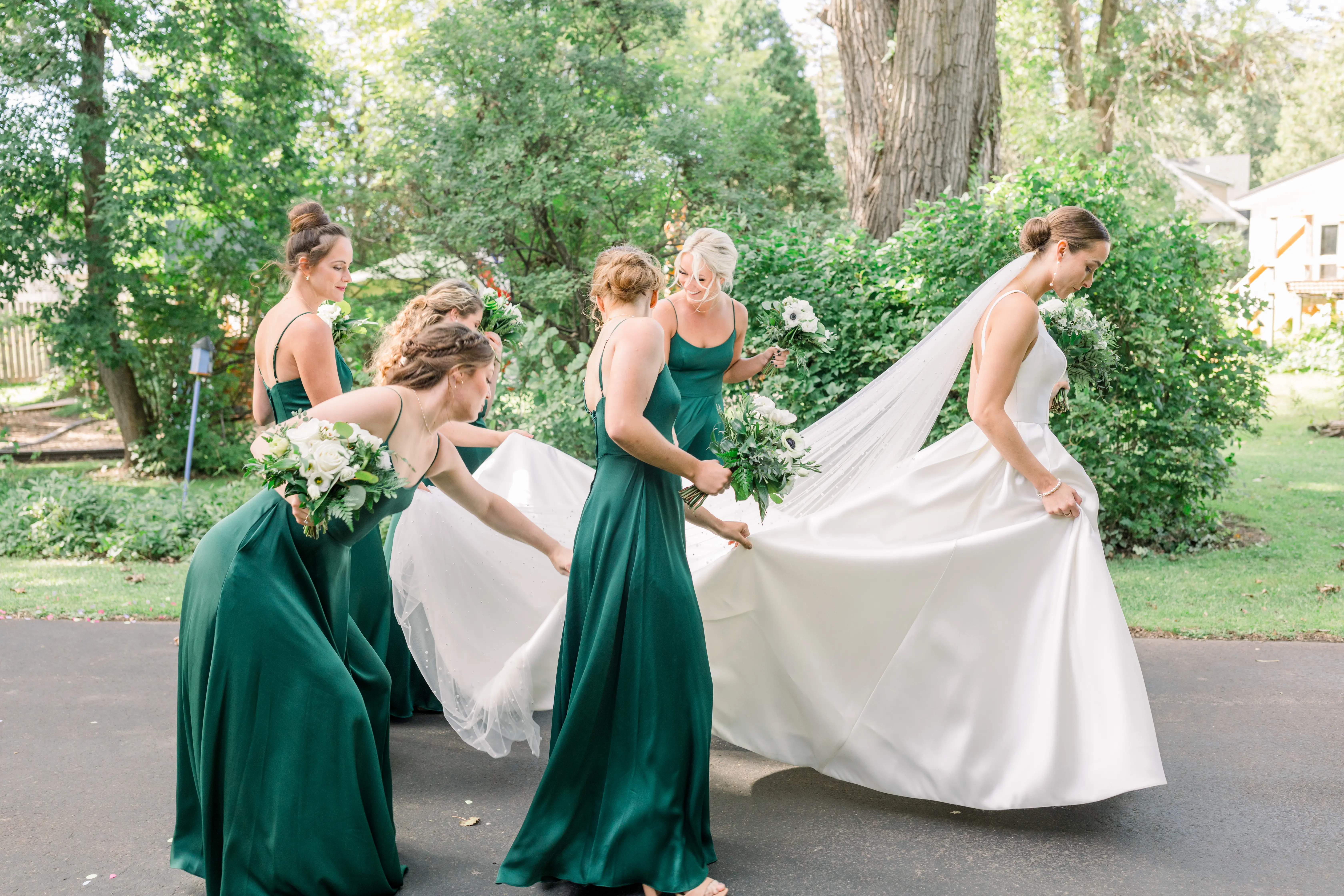 Bride Wearing Classic A-Line Wedding Dress Called Selena By Maggie Sottero With Bridesmaids Carrying Her Train