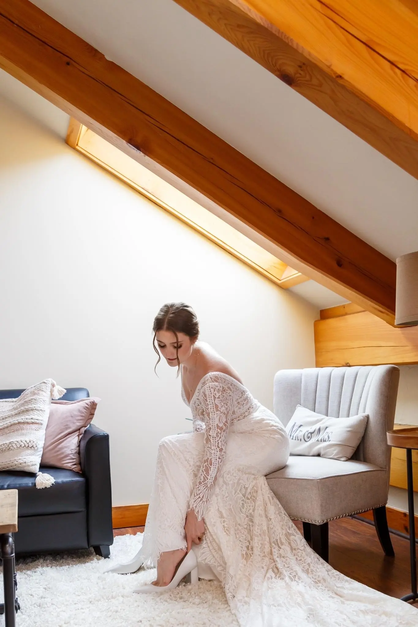 Bride Wearing Boho Sleeved Wedding Dress Called Drita By Maggie Sottero Putting On Her Shoe