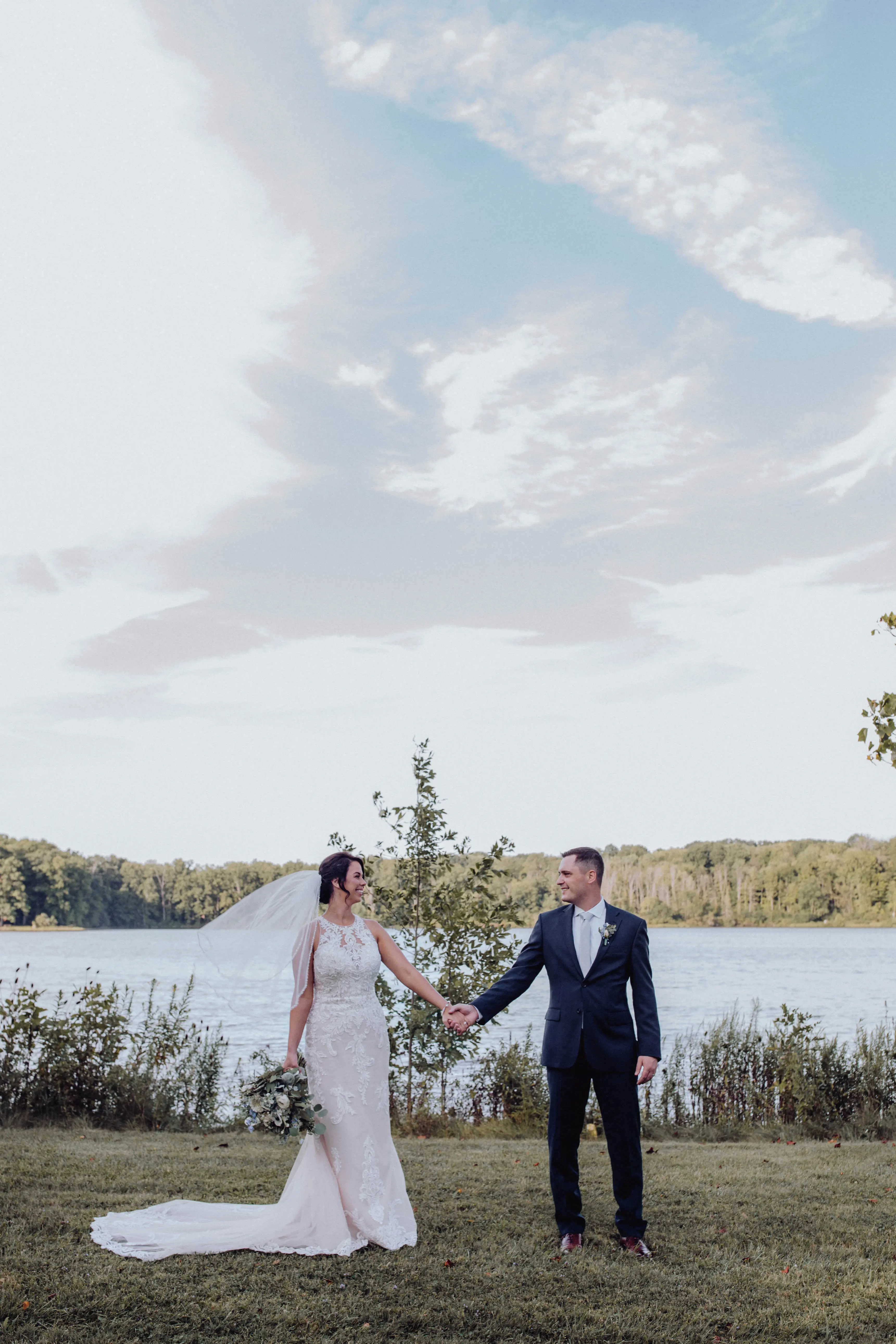 Bride with groom wearing budget friendly fit and flare wedding dress