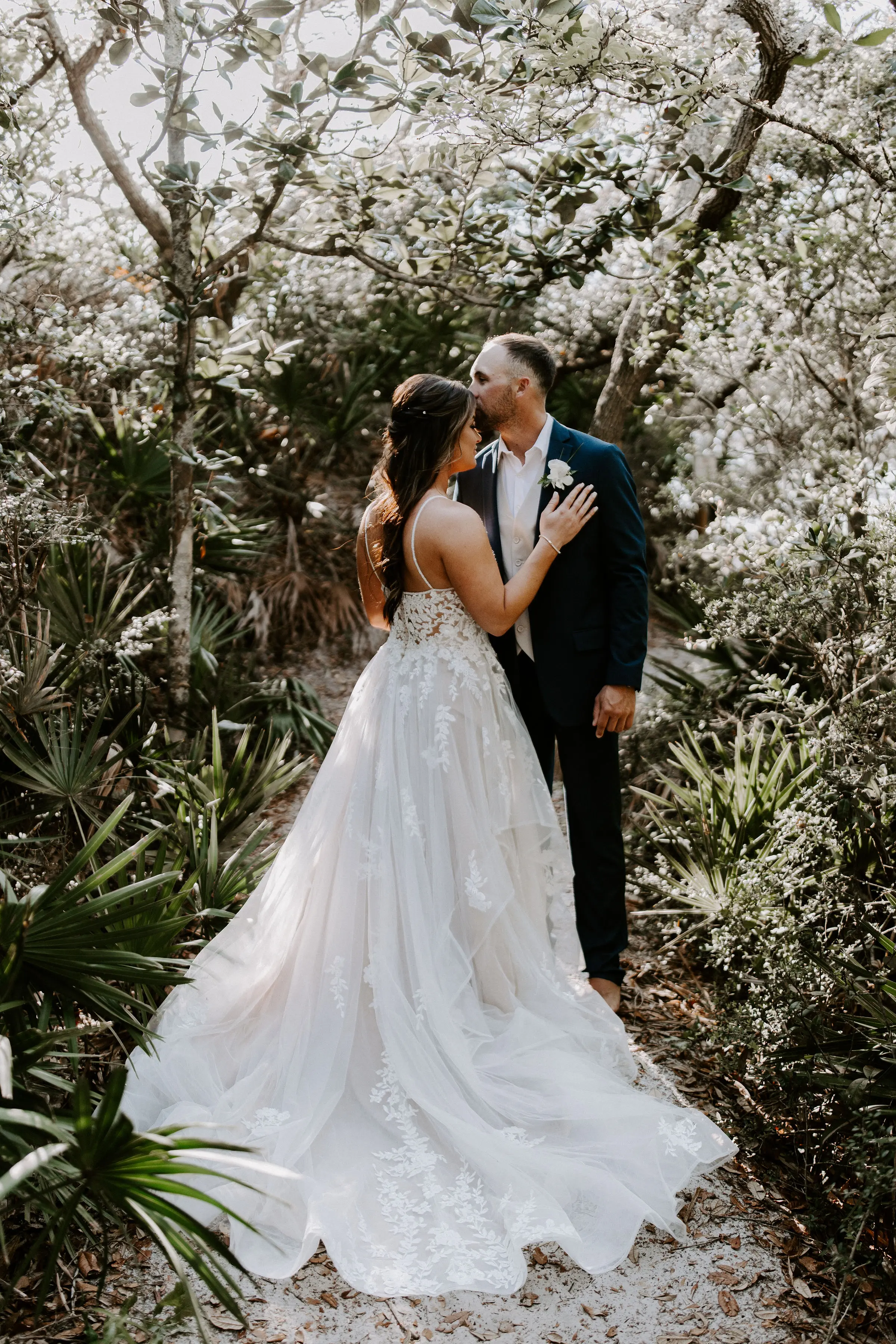 Real Bride wearing A-Line wedding dress with tiered ruffled called Lettie by Rebecca Ingram.