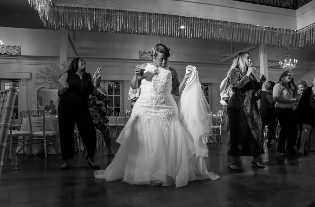 Bride dancing in wedding dress called Veda.