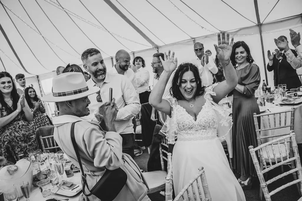 Bride wearing Lorraine by Rebecca Ingram at her reception