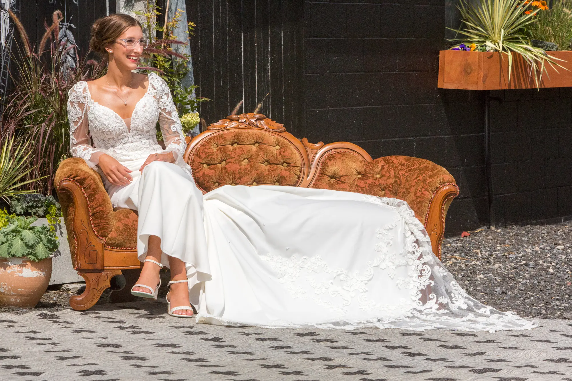 Bride Wearing Lace Mermaid Wedding Gown Called Nikki By Maggie Sottero Sitting On A Couch
