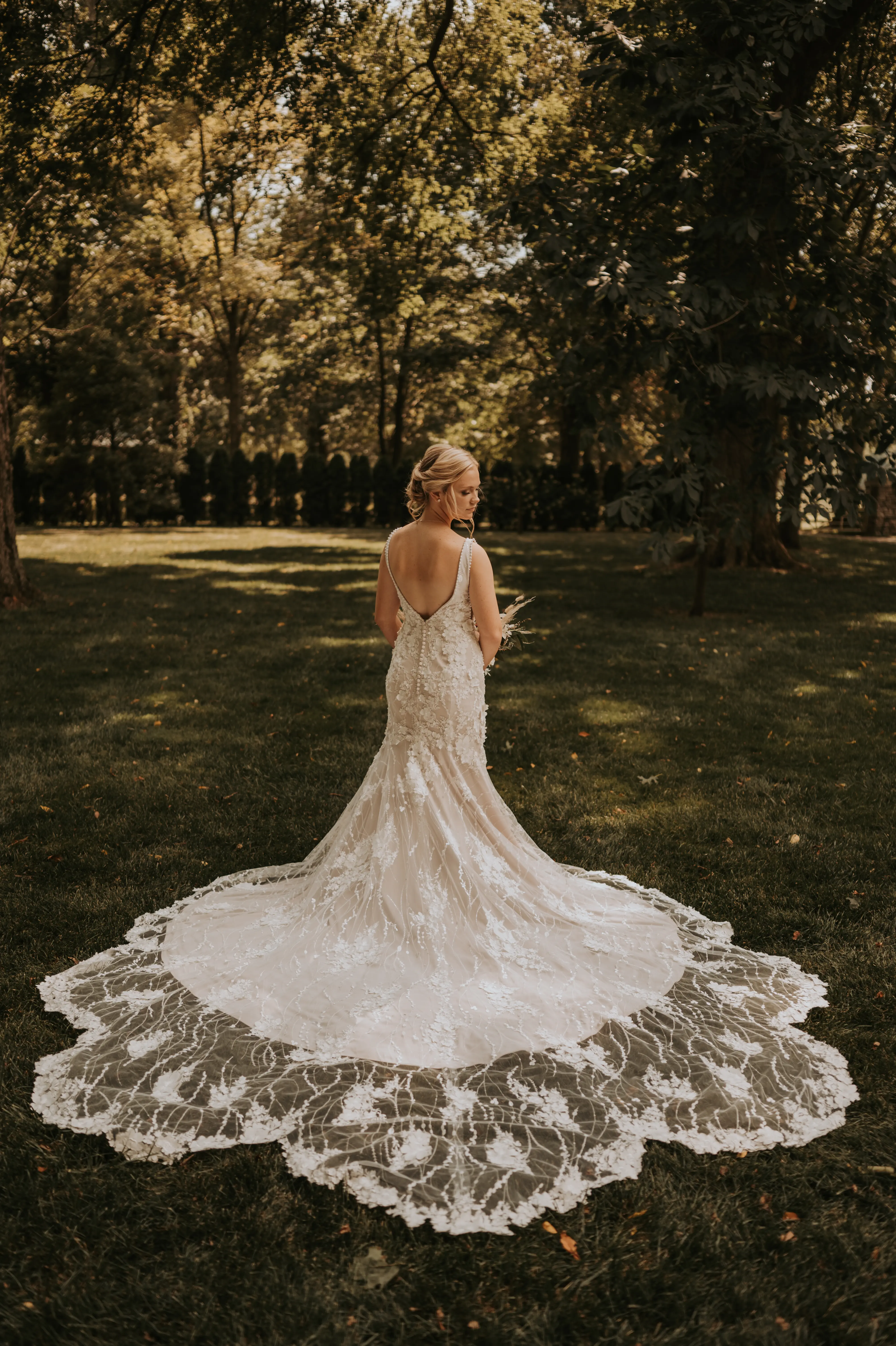Real Bride in Mermaid Wedding Dress with 3-D Floral Motifs and Extended Scalloped Lace Train Called Cruz by Sottero & Midgley