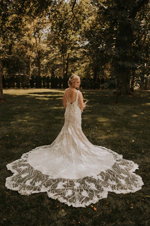 Real Bride in Mermaid Wedding Dress with 3-D Floral Motifs and Extended Scalloped Lace Train Called Cruz by Sottero & Midgley