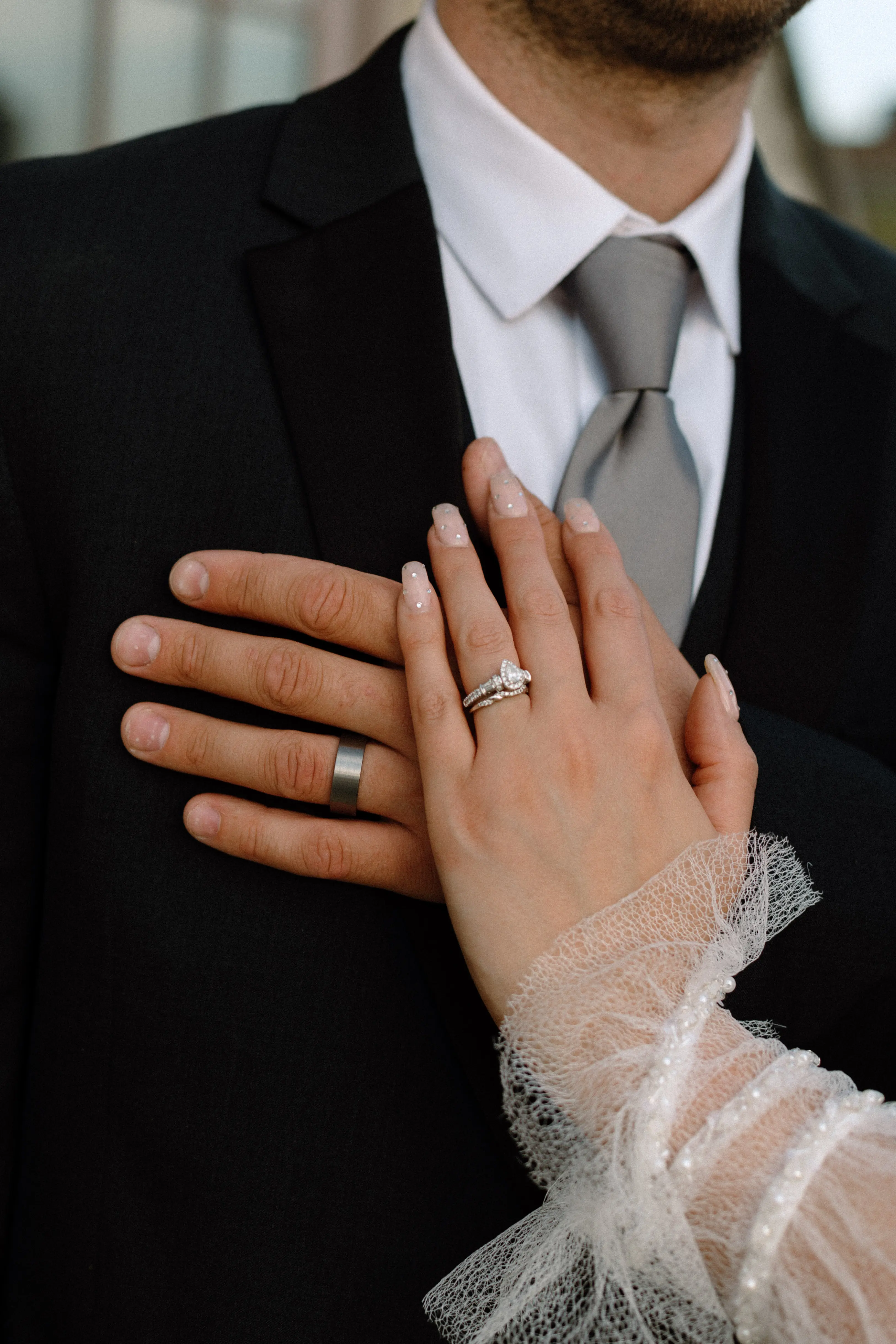 Photo Of Bride With Engagement Ring And Groom In Bishop Sleeve Wedding Dress Called Joanne By Rebecca Ingram