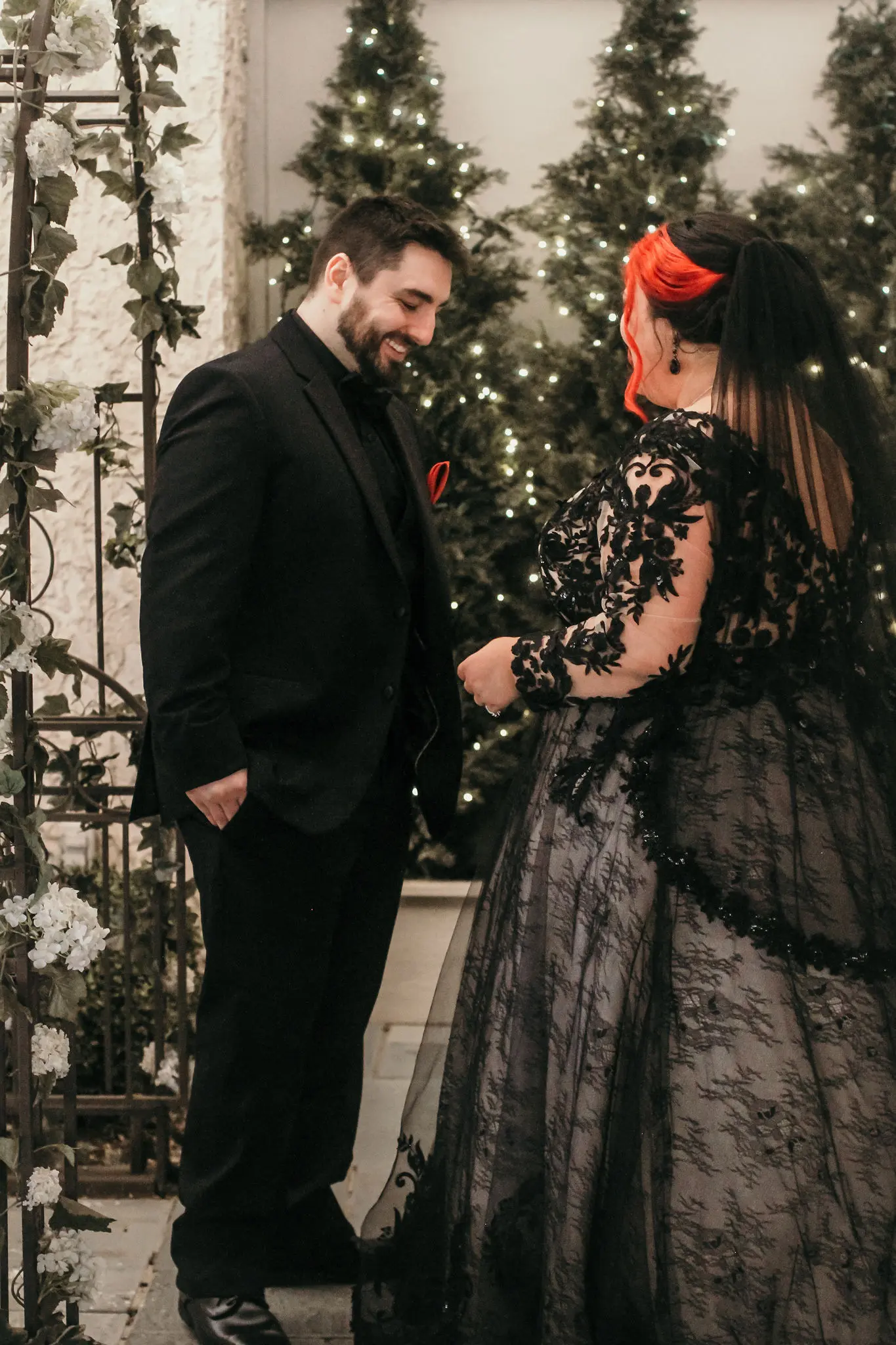 Groom Smiles At Bride In Black Lace Long Sleeve Ball Gown Wedding Dress Called Zander By Sottero And Midgley
