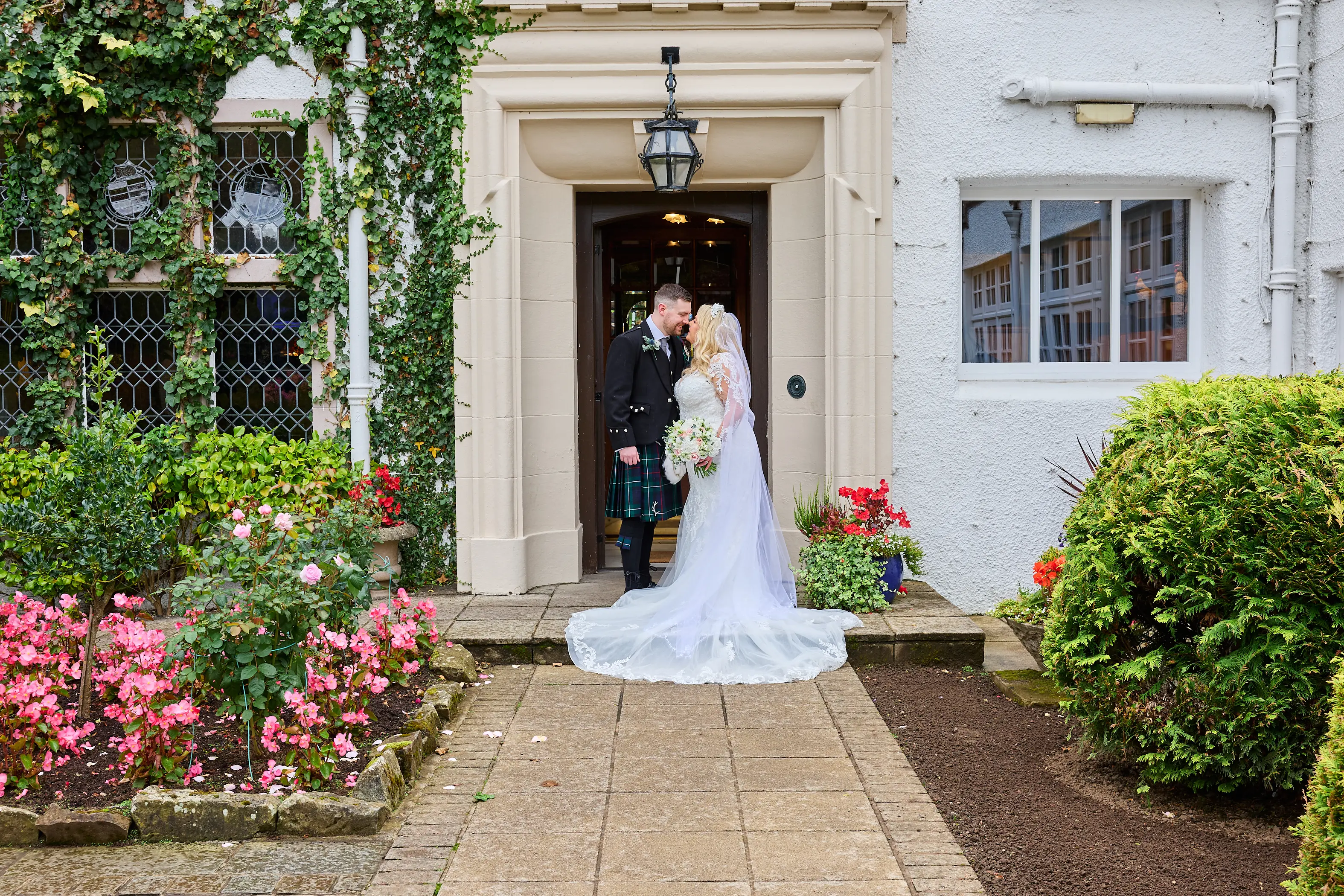 Bride wearing Saige by Maggie Sottero kissing her husband