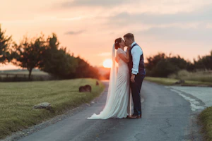 Groom With Bride Wearing Ivory Satin Sheath Wedding Dress Ettia By Maggie Sottero