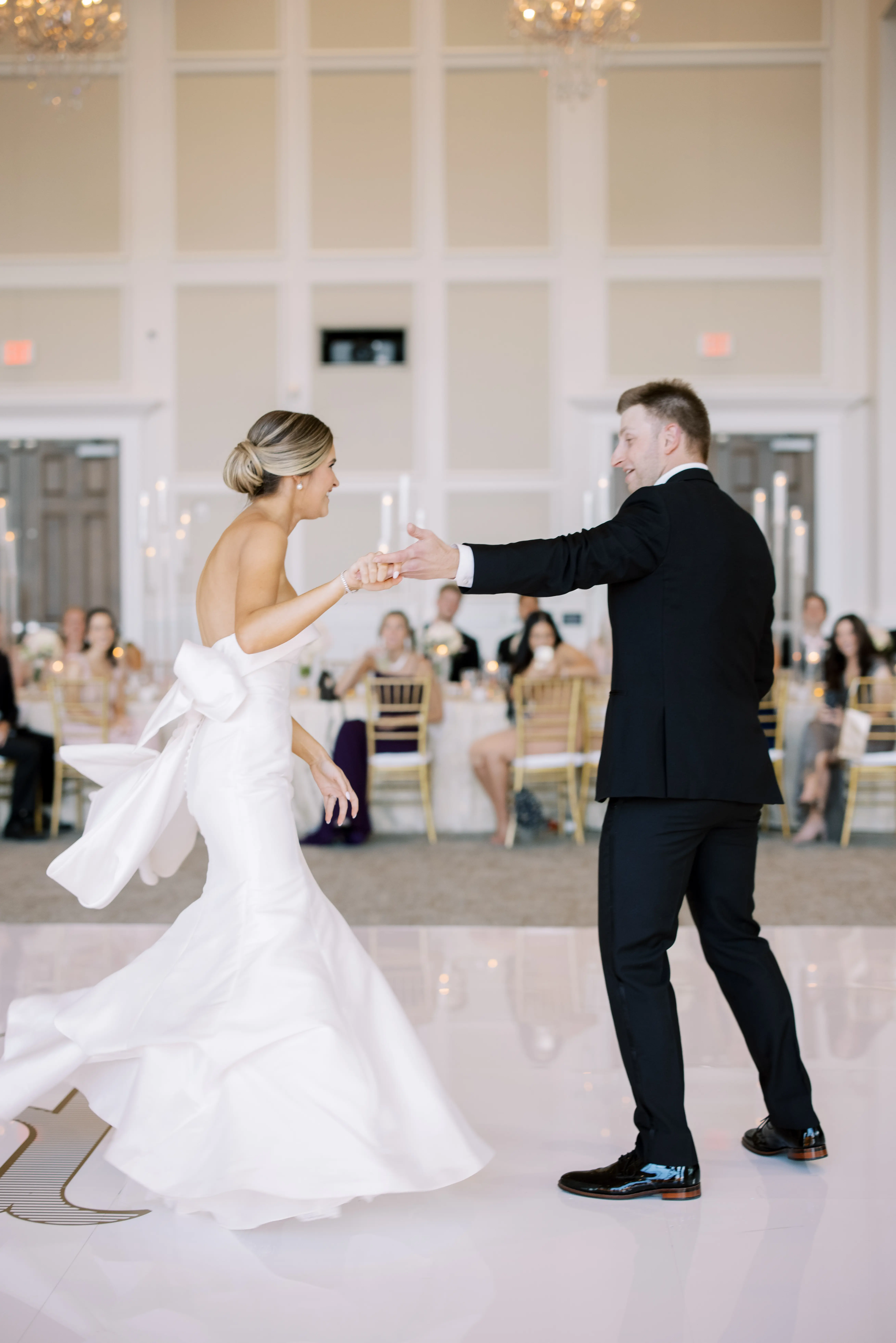 Groom With Bride Wearing Simple Sheath Wedding Dress With Bow Back Called Mitchell By Maggie Sottero