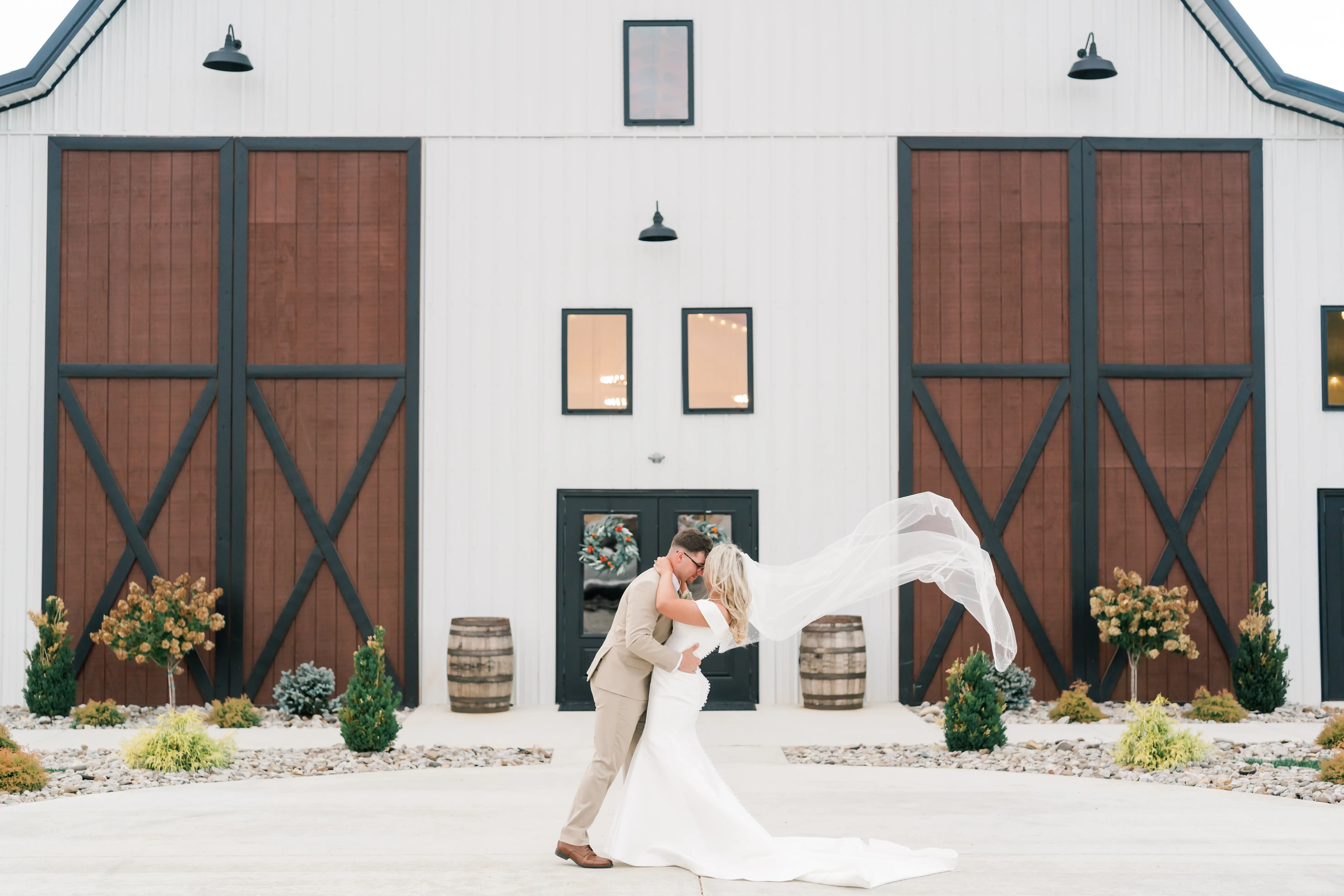 Bride wearing Josie wedding dress by Rebecca Ingram with her husband