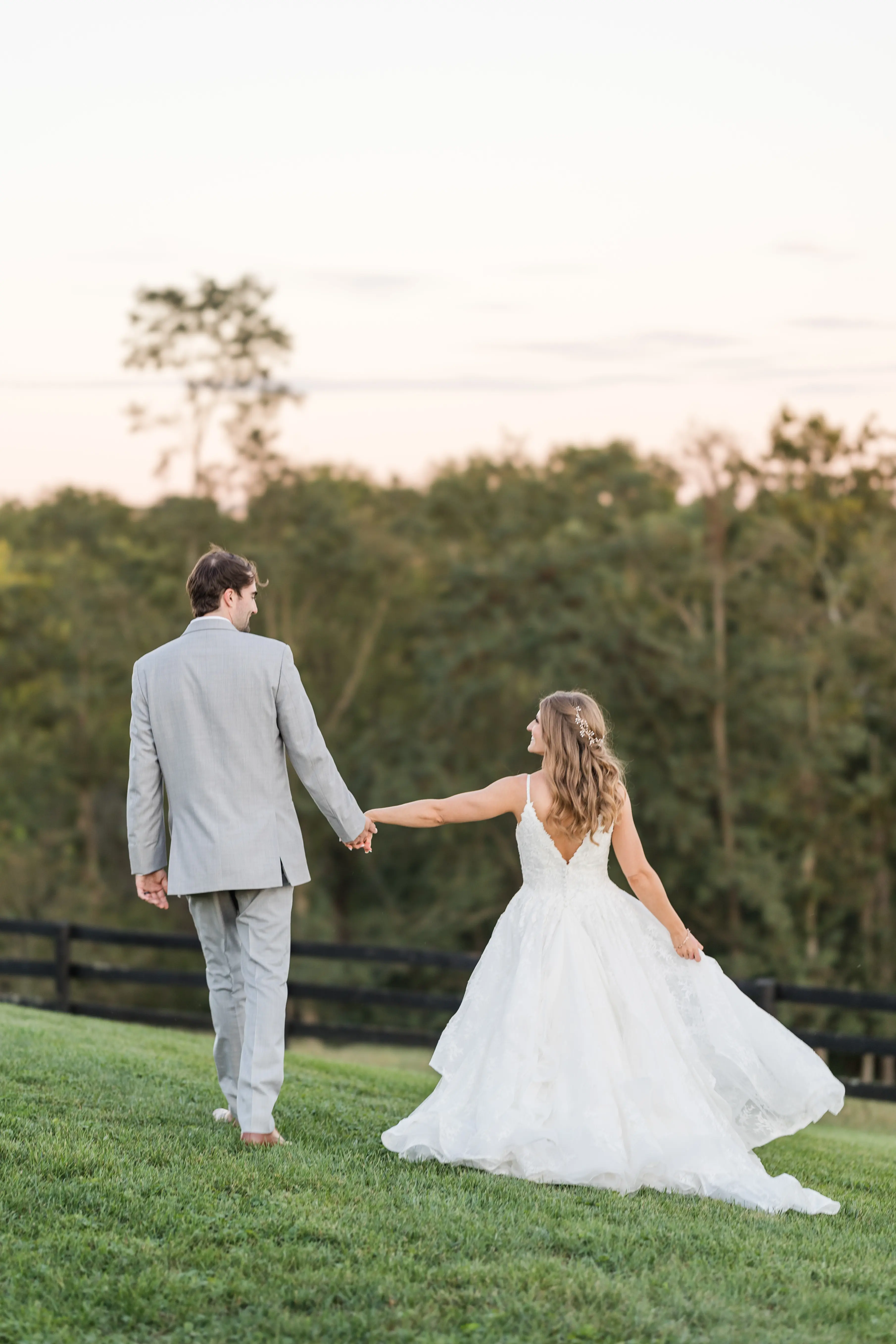 Groom with Bride in Modern Princess Wedding Dress with a Tiered Sequin Tulle Skirt Called Yuri by Maggie Sottero
