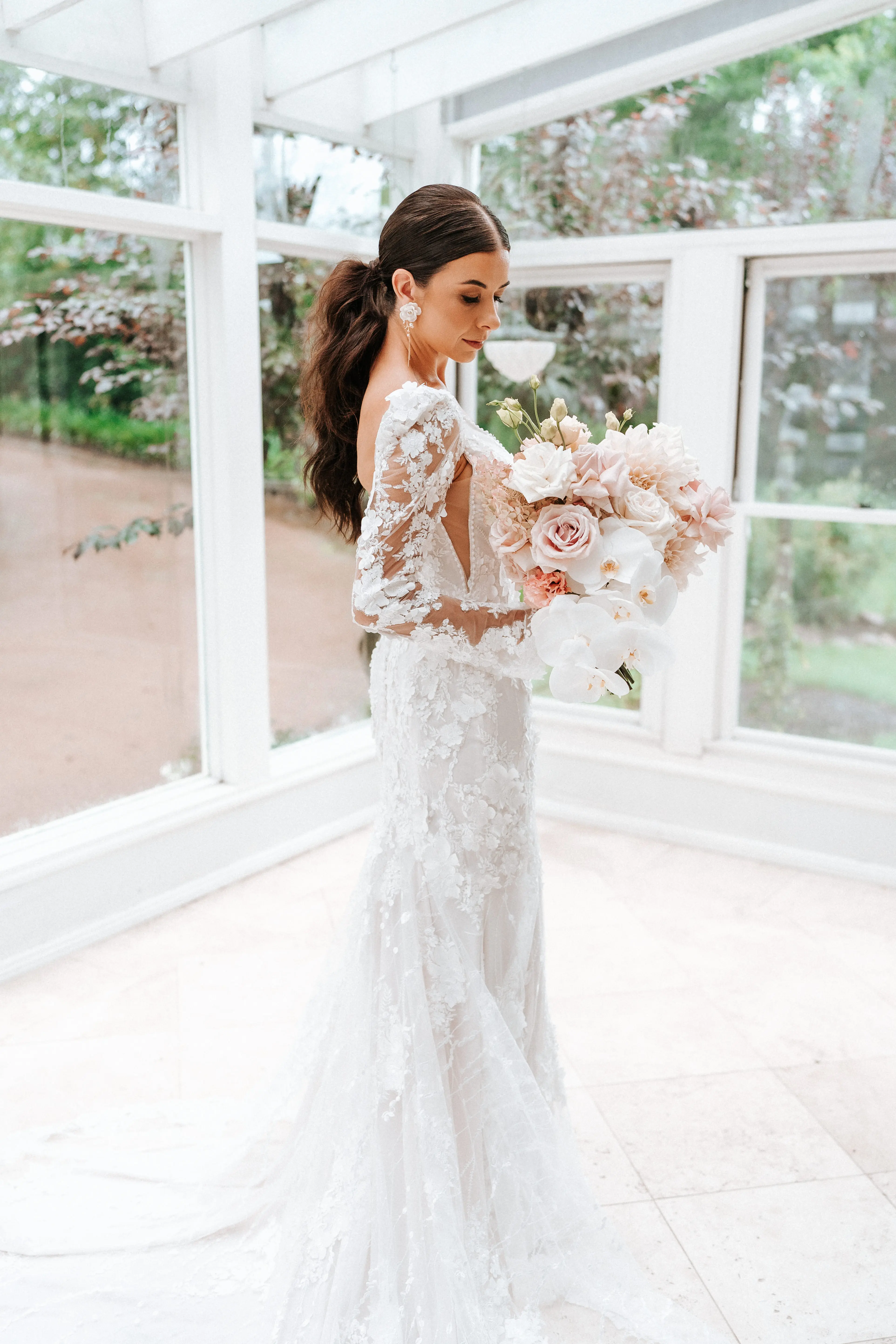 Real Bride wearing puff sleeve wedding dress with 3D floral details called Cruz by Sottero and Midgley..
