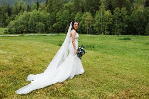 Bride In Strapless Mermaid Wedding Dress With Oversized Floral Lace Called Hattie By Rebecca Ingram