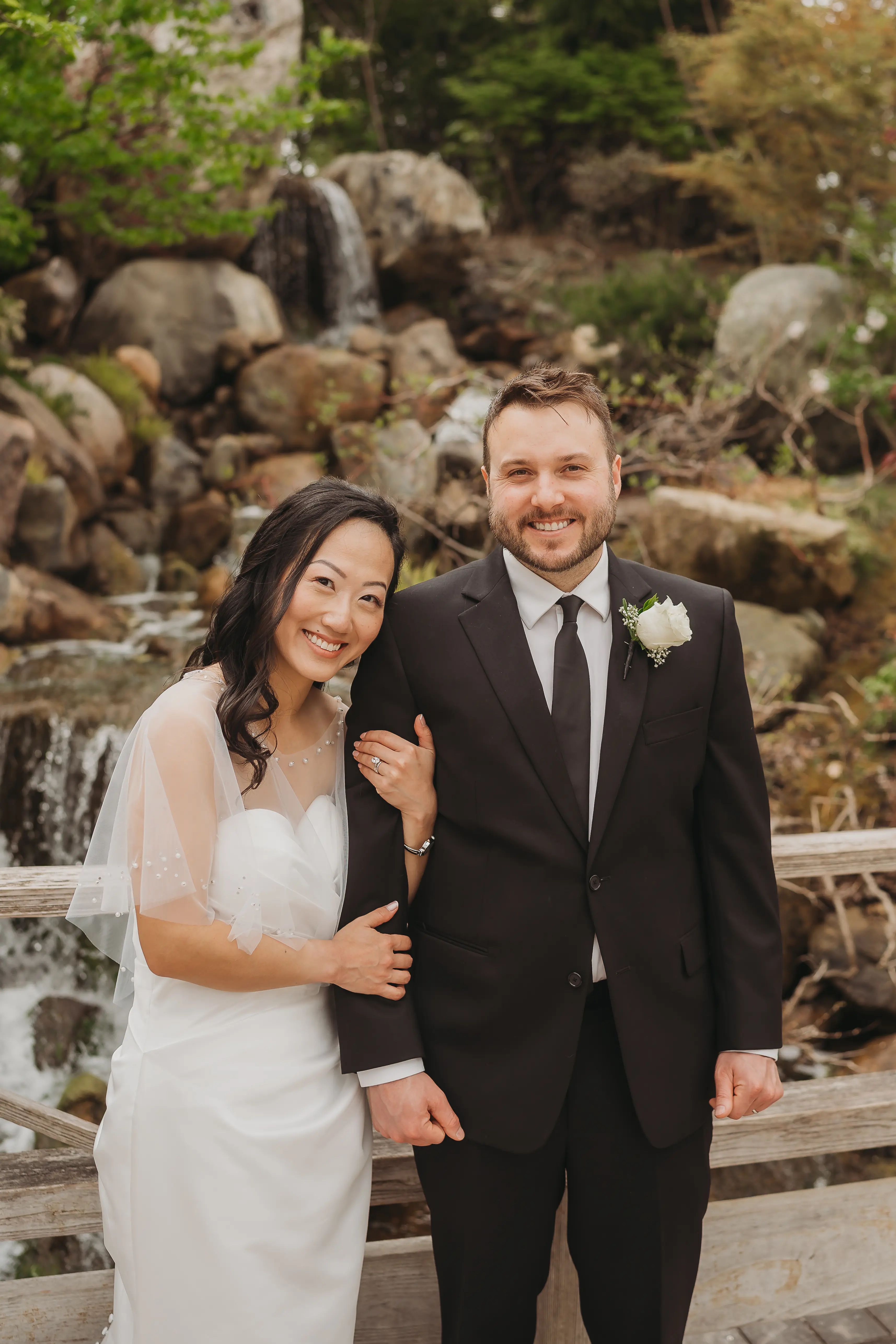 Bride wearing Clover by Rebecca Ingram with her husband
