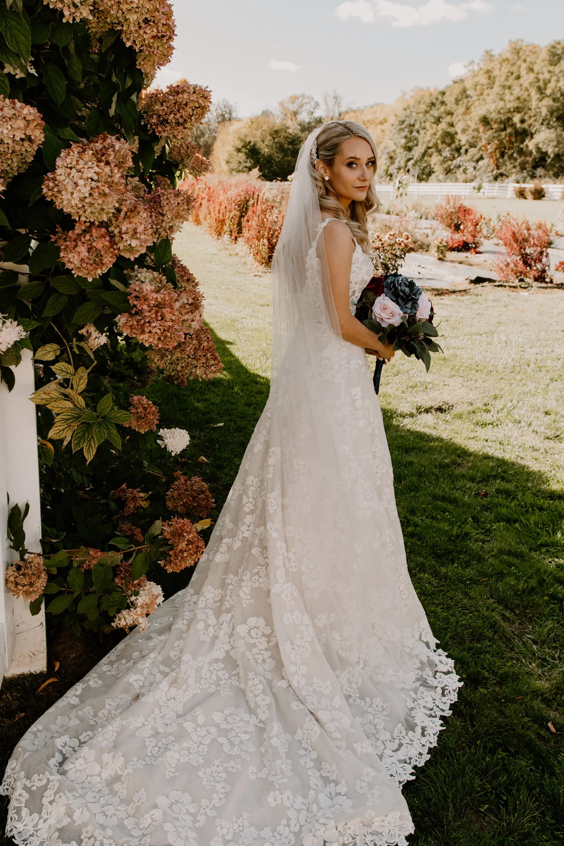 Bride Wearing Square Neck Long Sleeve Floral Wedding Dress Called Sawyer By Sottero And Midgley With Long Veil