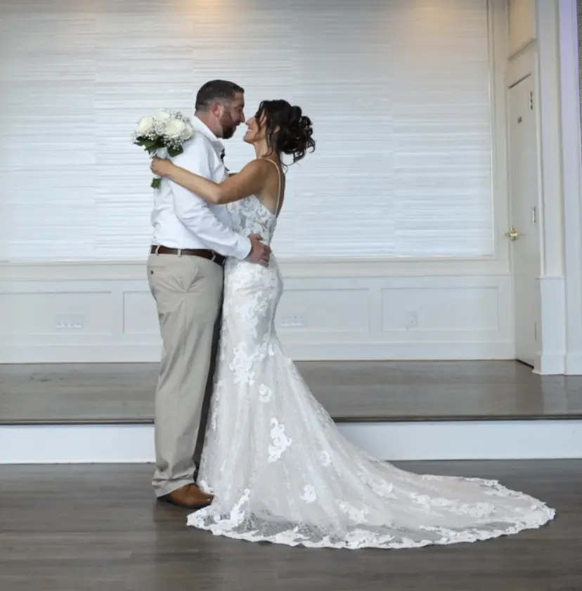 Groom With Bride Wearing Lace Sheath Wedding Dress Tuscany Lynette By Maggie Sottero