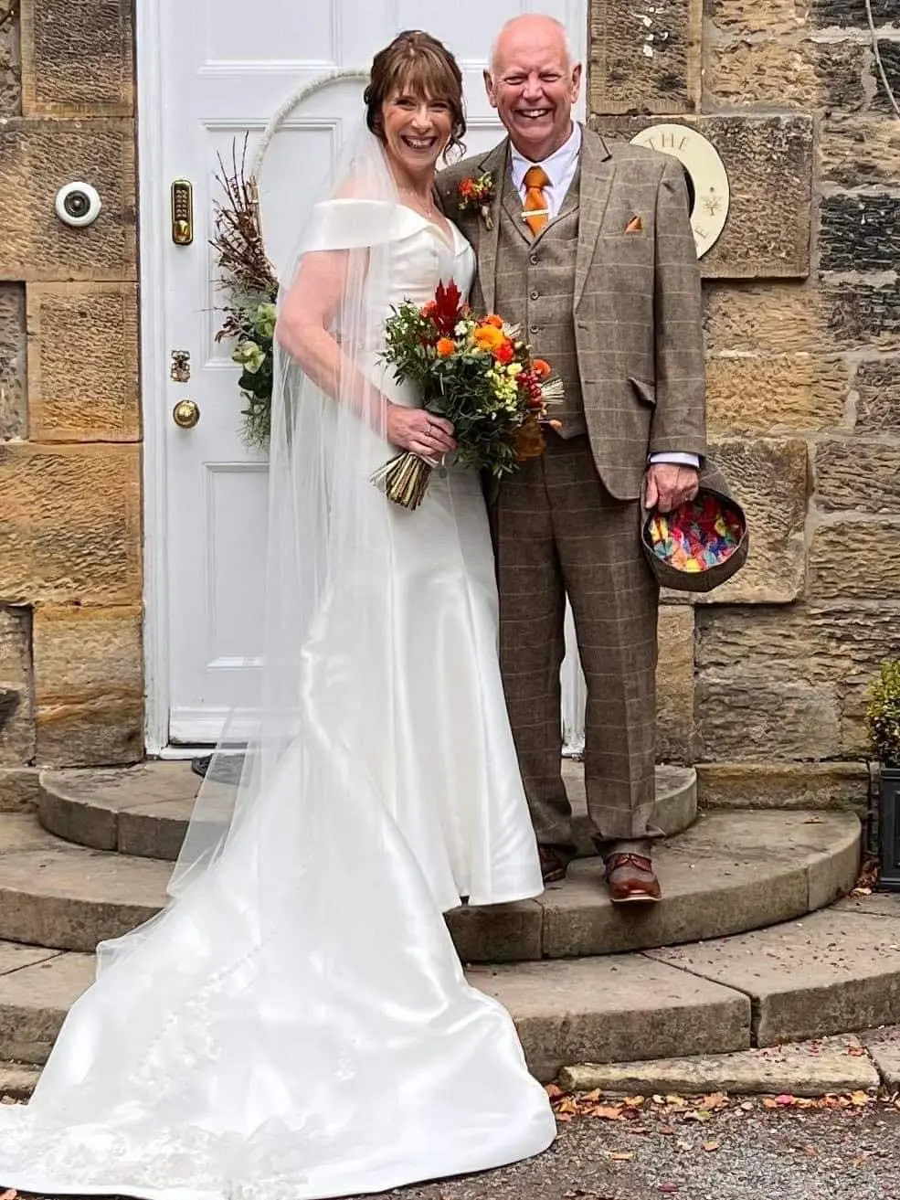 Groom With Bride Wearing Off The Shoulder Fit-And-Flare Josie By Maggie Sottero