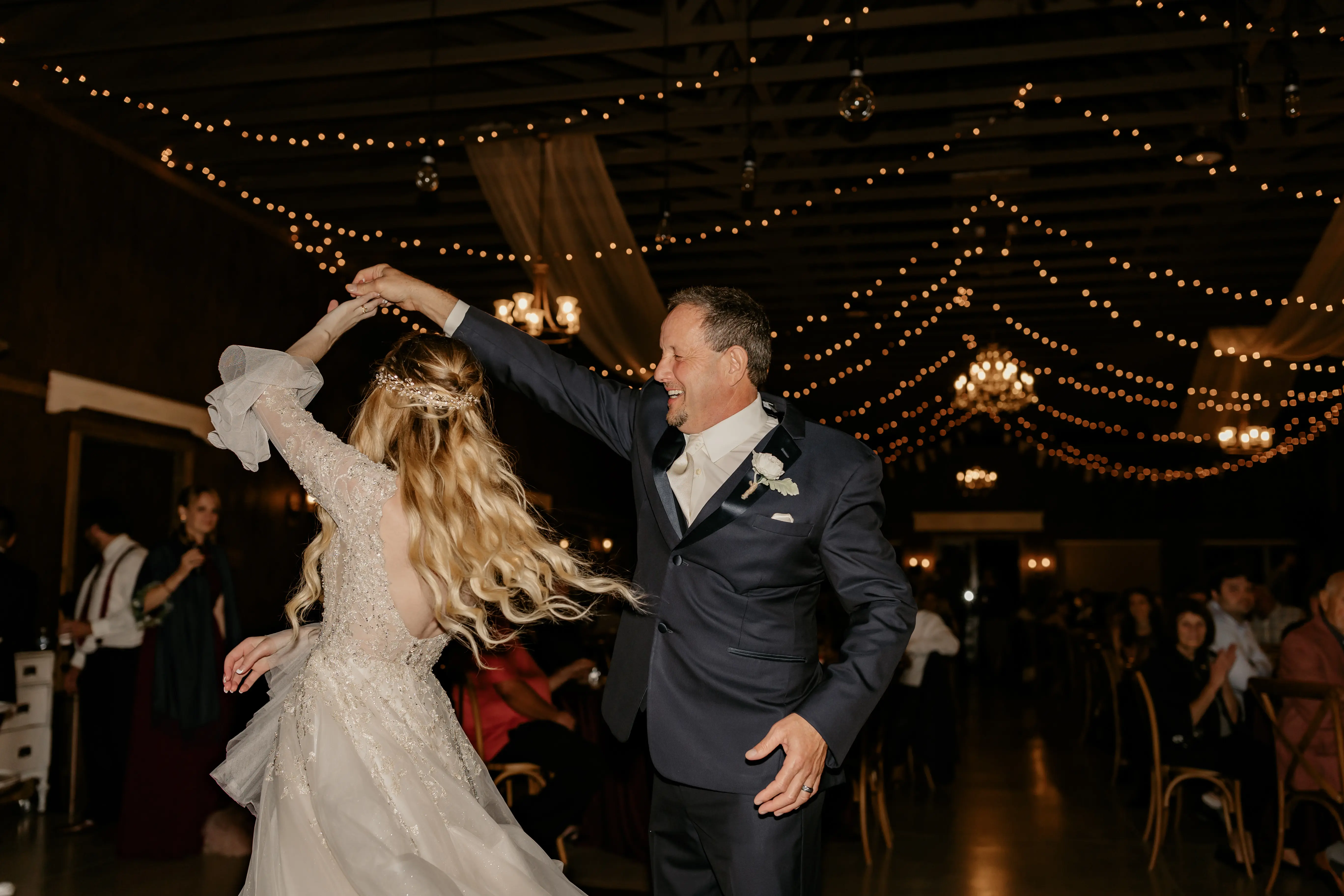 Father and bride dancing at the wedding party.
