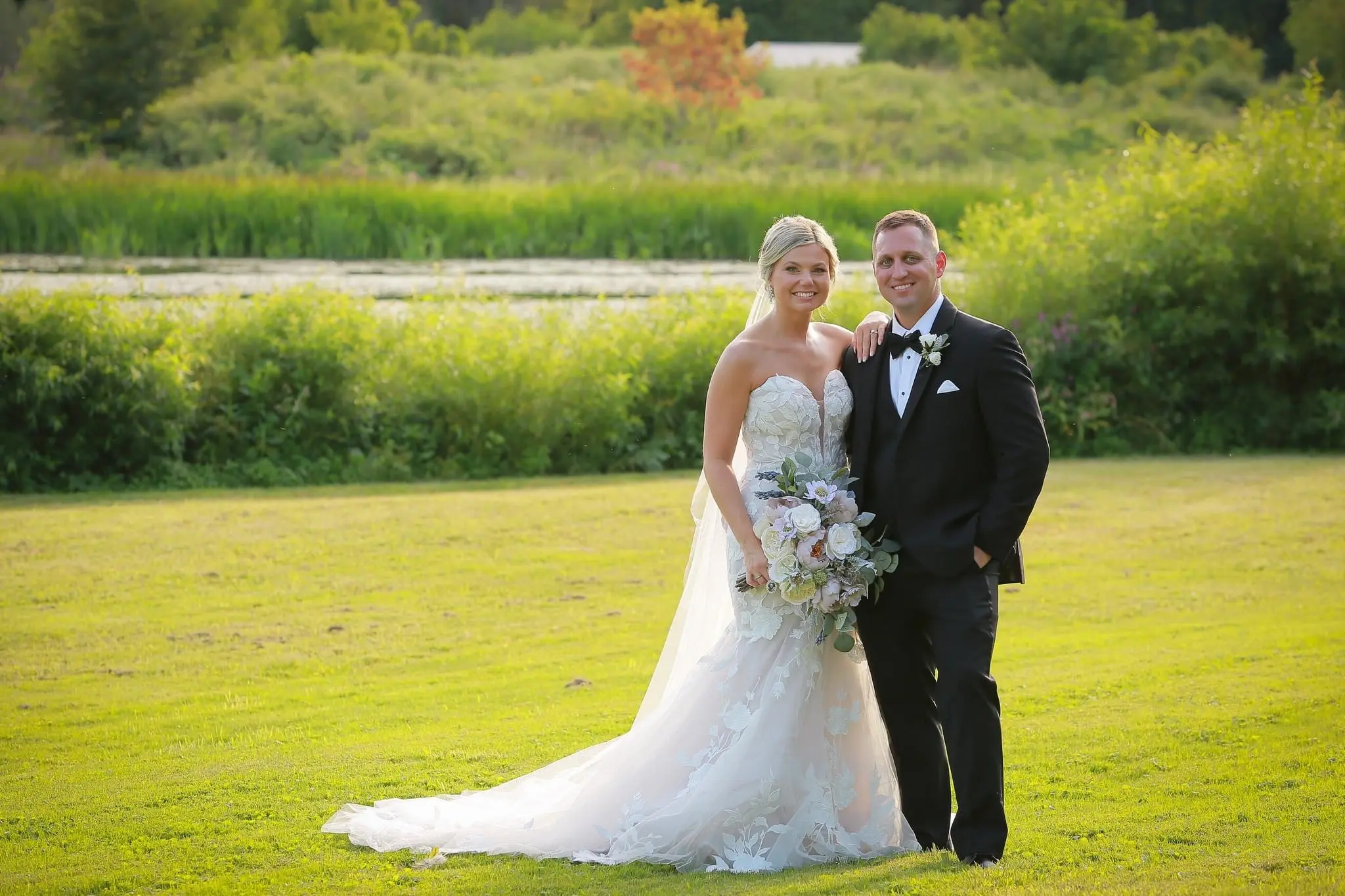 Groom With Bride Wearing Mermaid Wedding Dress With Oversized Floral Lace Hattie By Rebecca Ingram