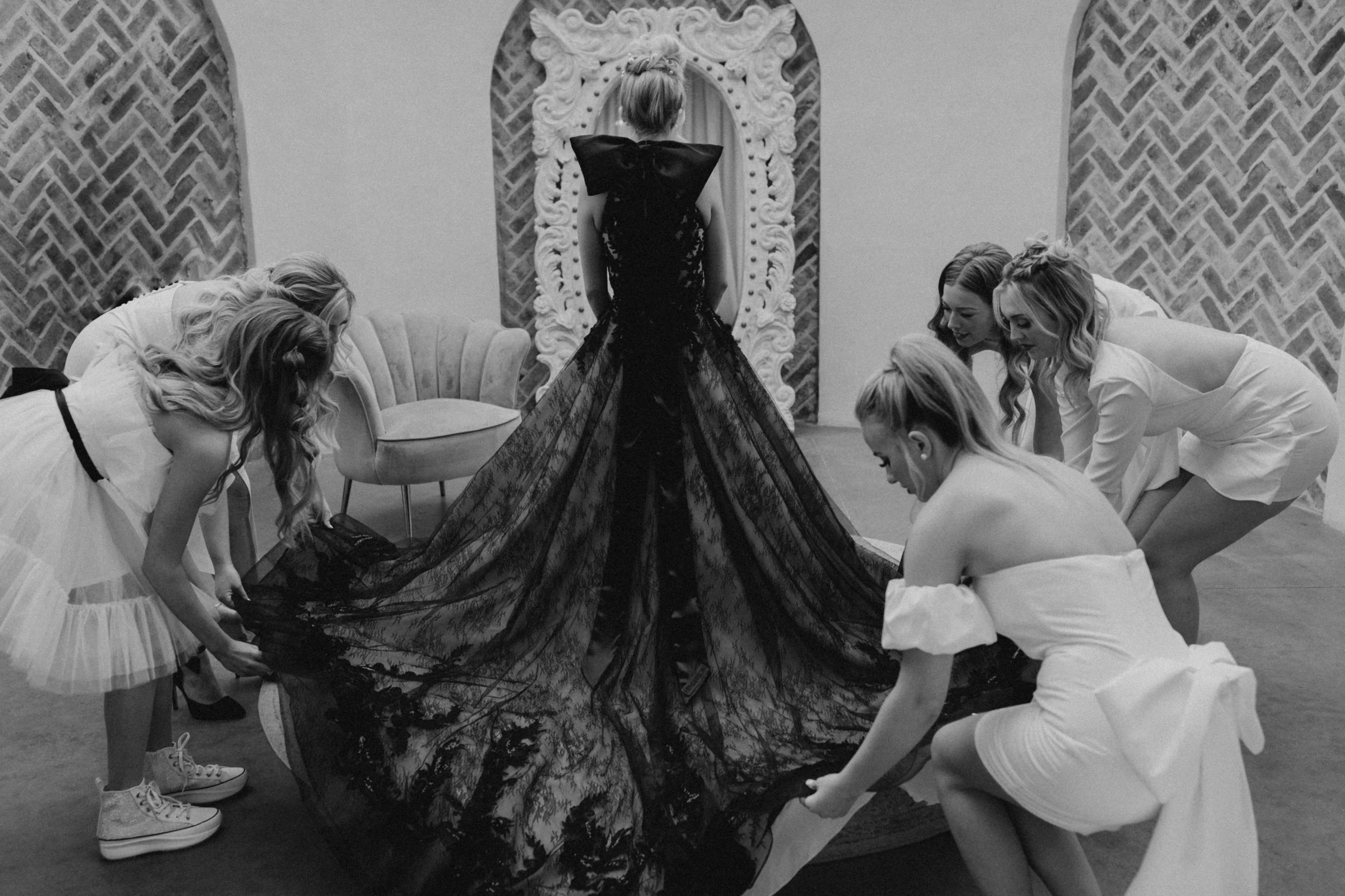 Bridemaids Help Real Bride in Beautiful Black Ball Gown Wedding Dress with Contrasting Layers of Tulle, Lace Motifs, and Chantilly Lace Called Zander by Sottero & Midgley