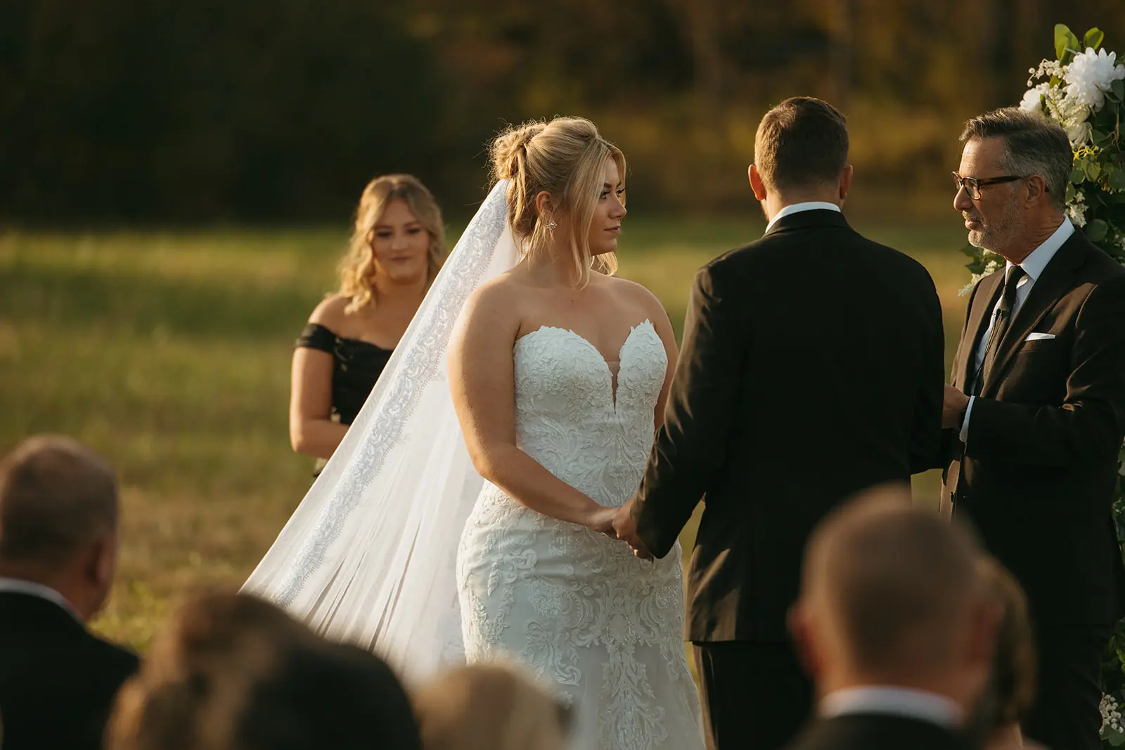 Bride Wearing Lace Mermaid Wedding Gown Called Toccara By Maggie Sottero With Groom At The Outdoor Ceremony