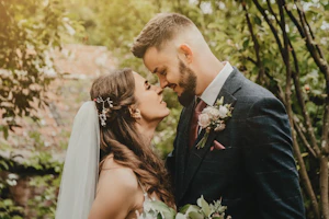 Groom With Bride Wearing Lace Sheath Wedding Dress Tuscany Lynette By Maggie Sottero