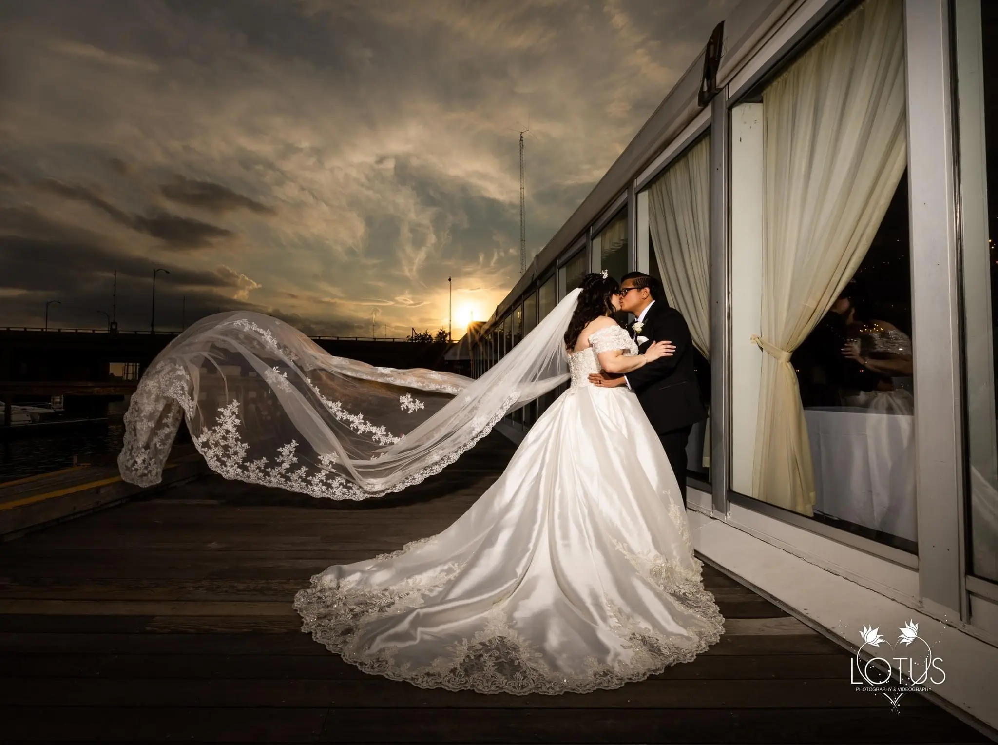 Bride in Satin Ball Gown Wedding Dress Featuring Decadent Beaded Lace Bodice, Kimora by Sottero & Midgley Embracing Groom