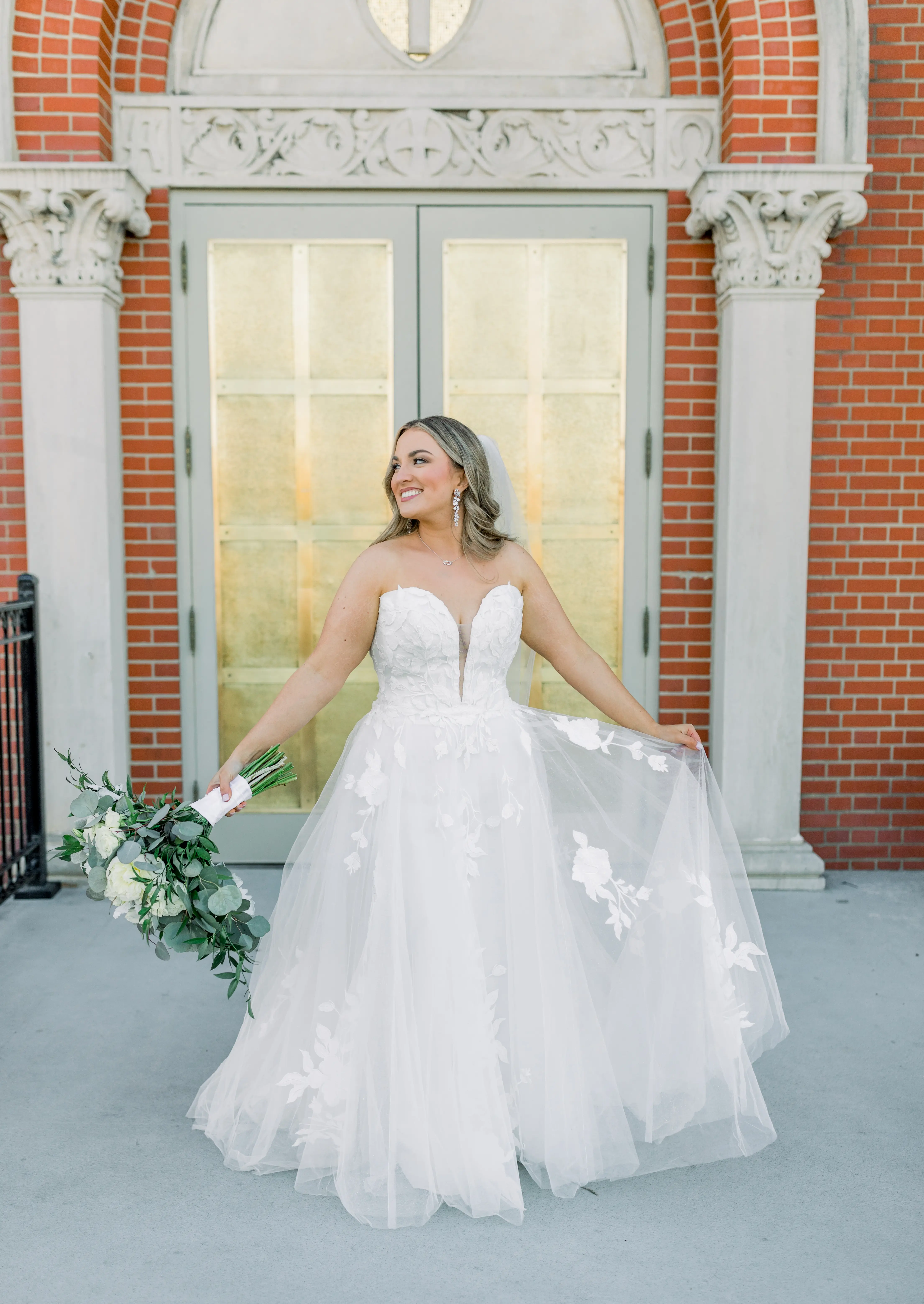 Bride wearing Hattie Lane Marie wedding dress by Rebecca Ingram