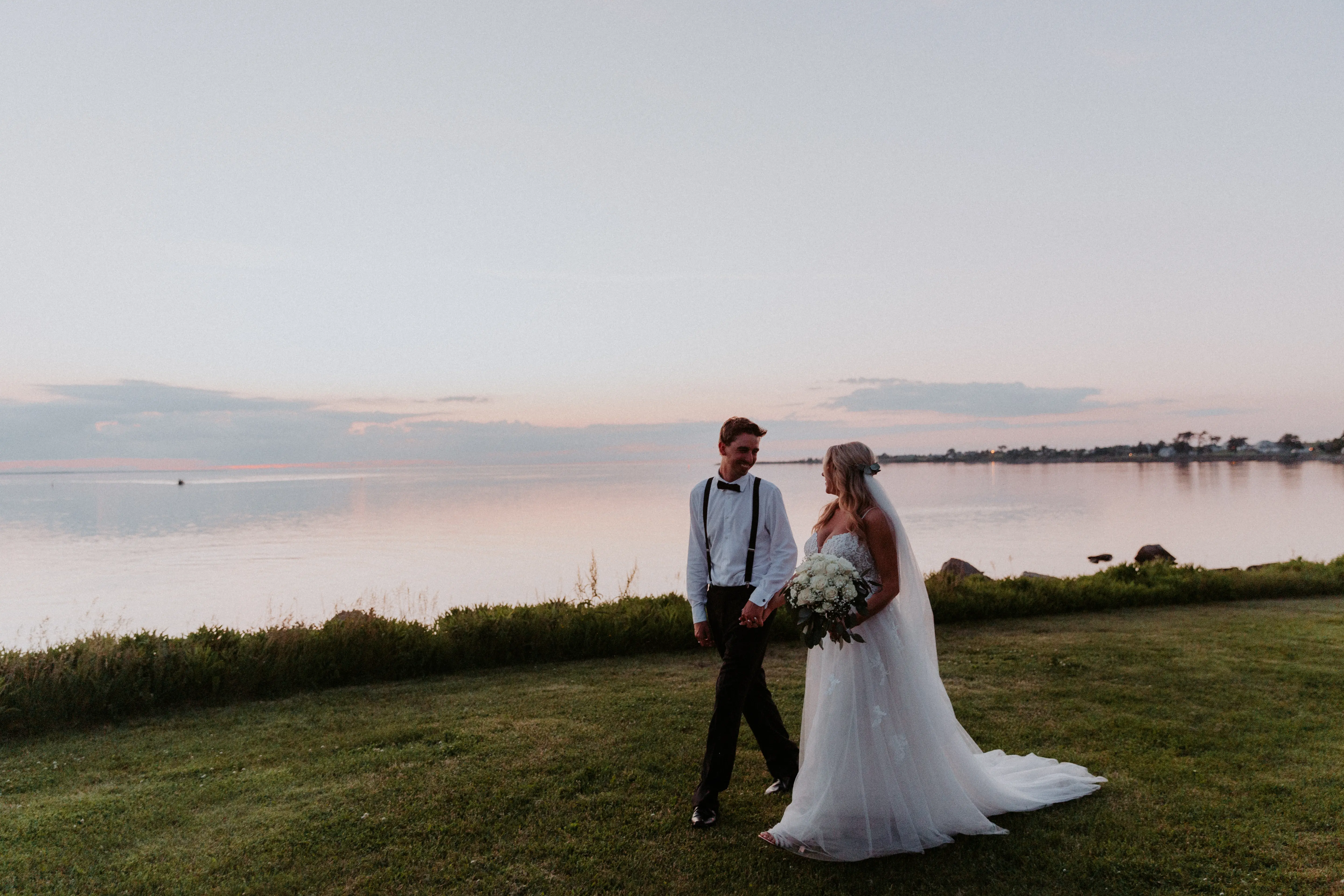 Groom with Bride in Flattering A-Line Spaghetti Strap Wedding Dress with Romantic Lace Called Marisol by Rebecca Ingram