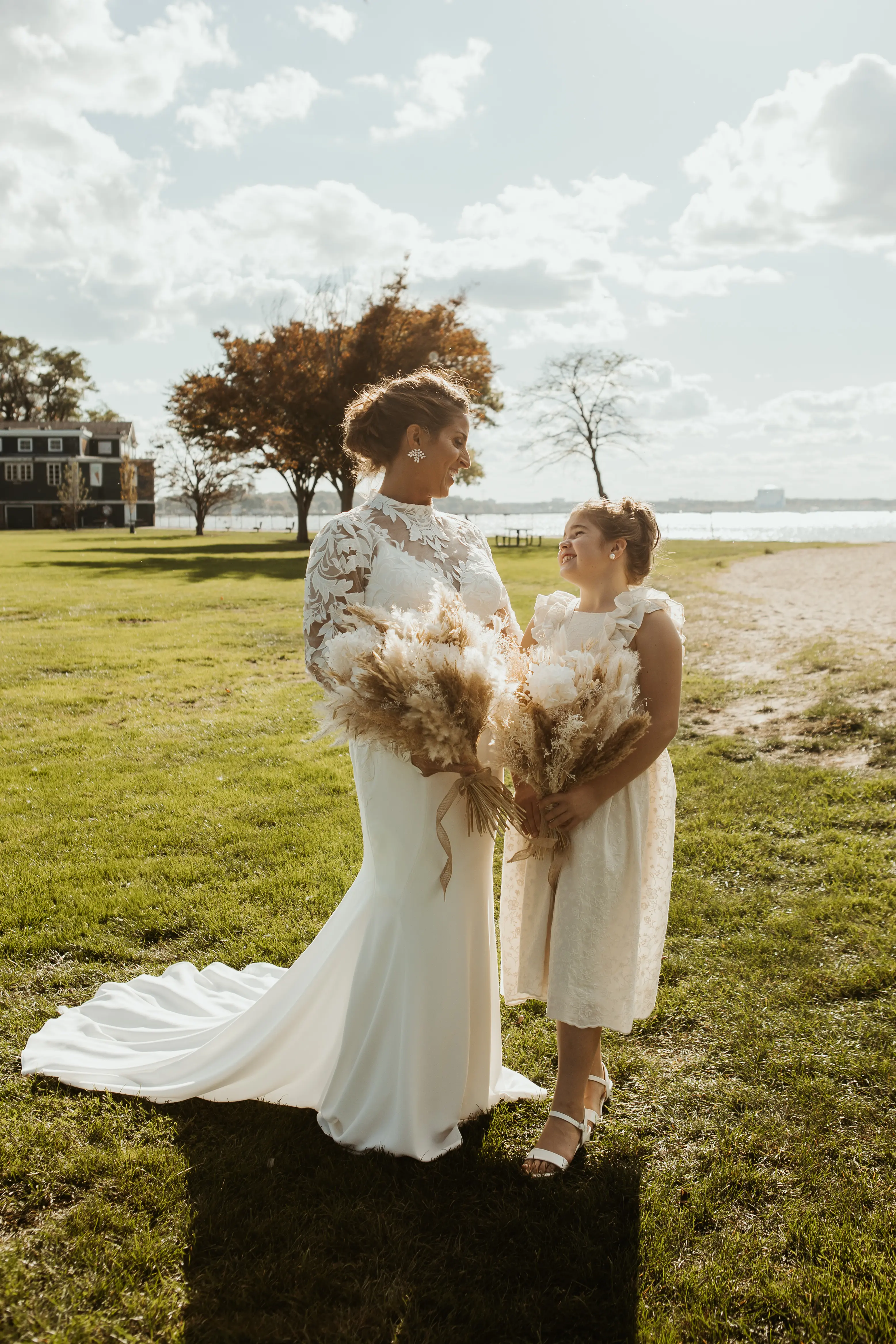 Bride Wearing Crepe Wedding Dress Called Dionne By Rebecca Ingram With Her Daugher Both Holding Bouquets