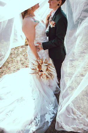 Bride Wearing Lace Fit and Flare Wedding Dress Called Hattie By Rebecca Ingram With Bride