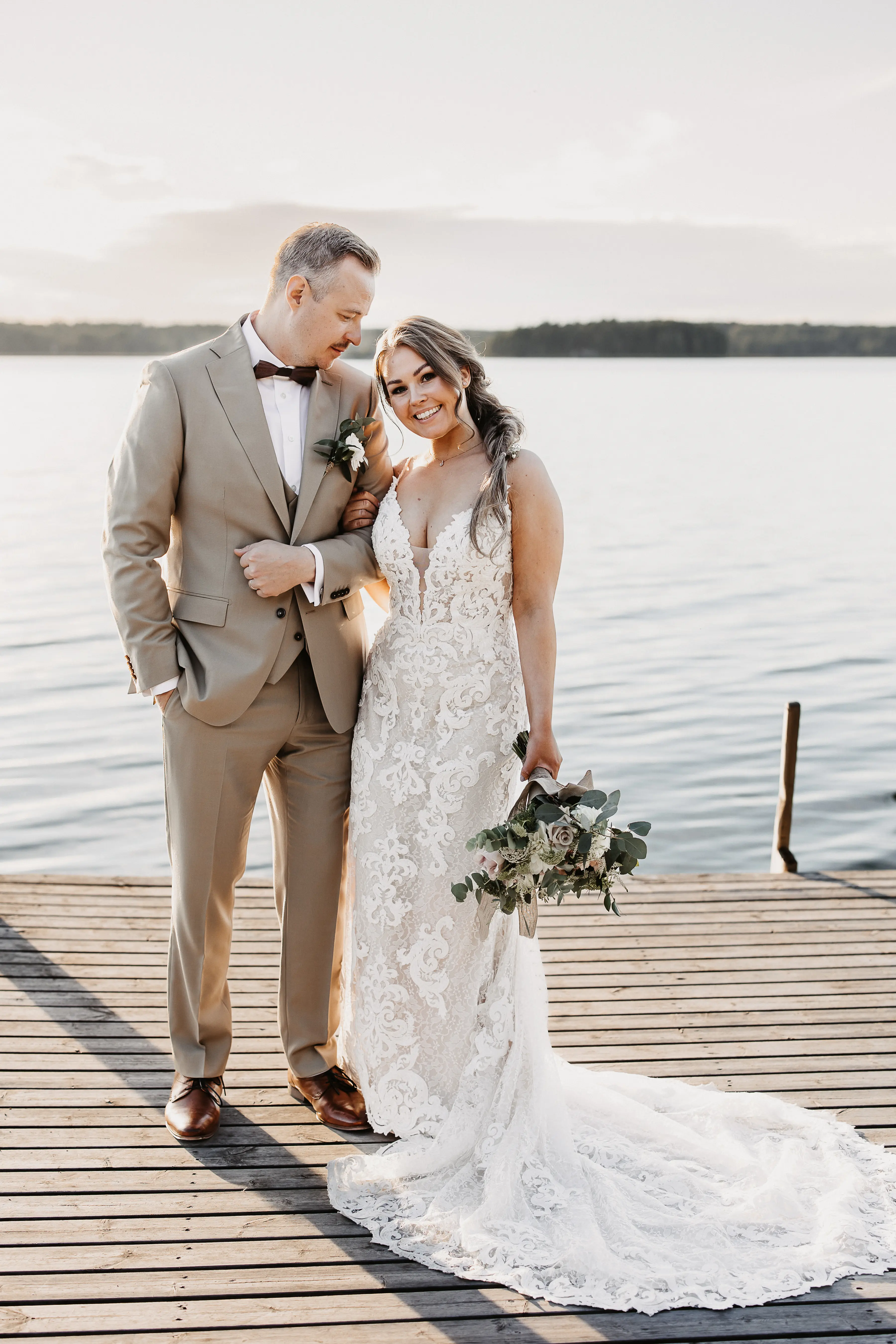 Bride Wearing Sexy Lace Wedding Dress Called Tuscany Lynette By Maggie Sottero With Groom On A Dock