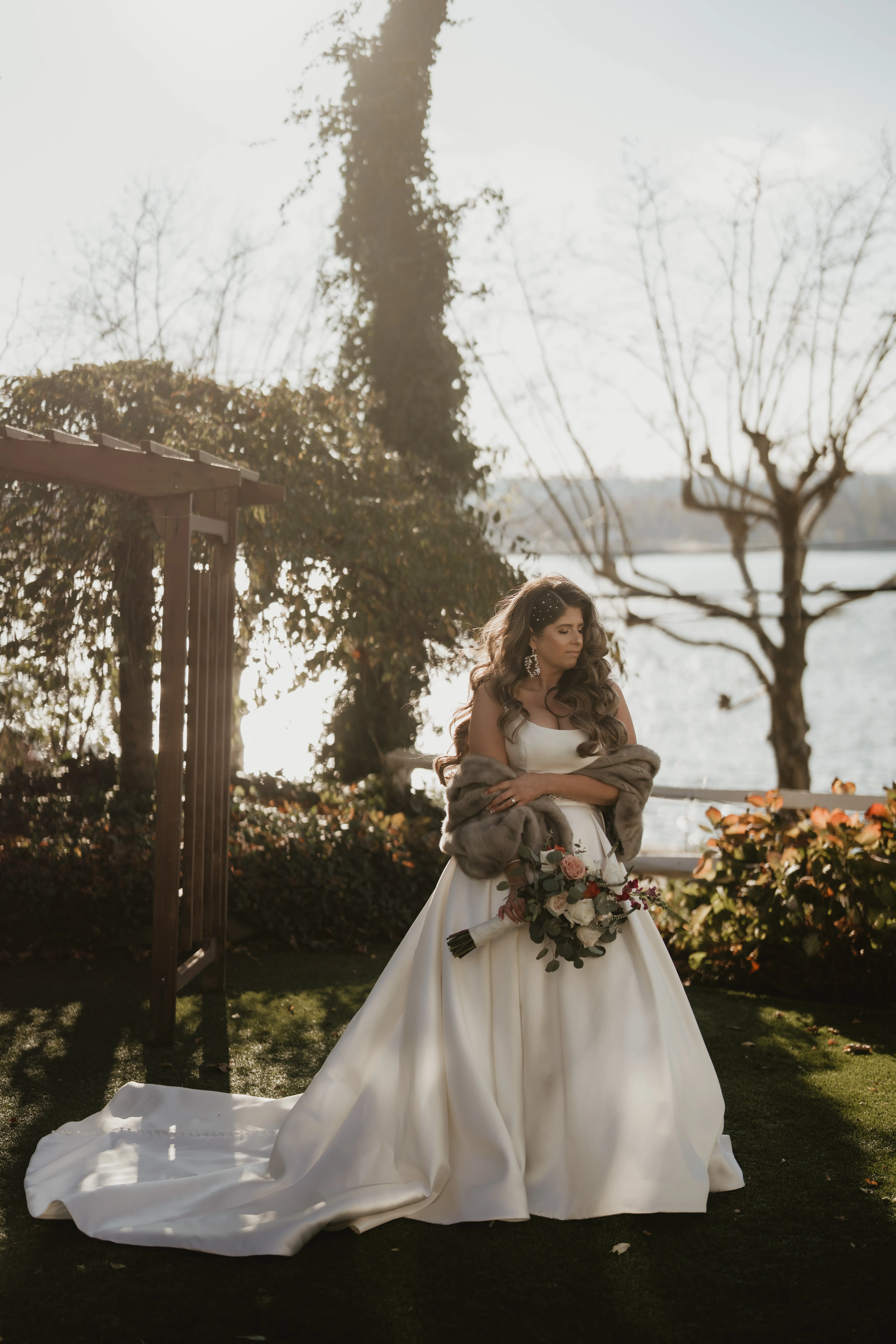 Bride In Simple Satin Wedding Dress Called Selena By Maggie Sottero With Fur Wrap