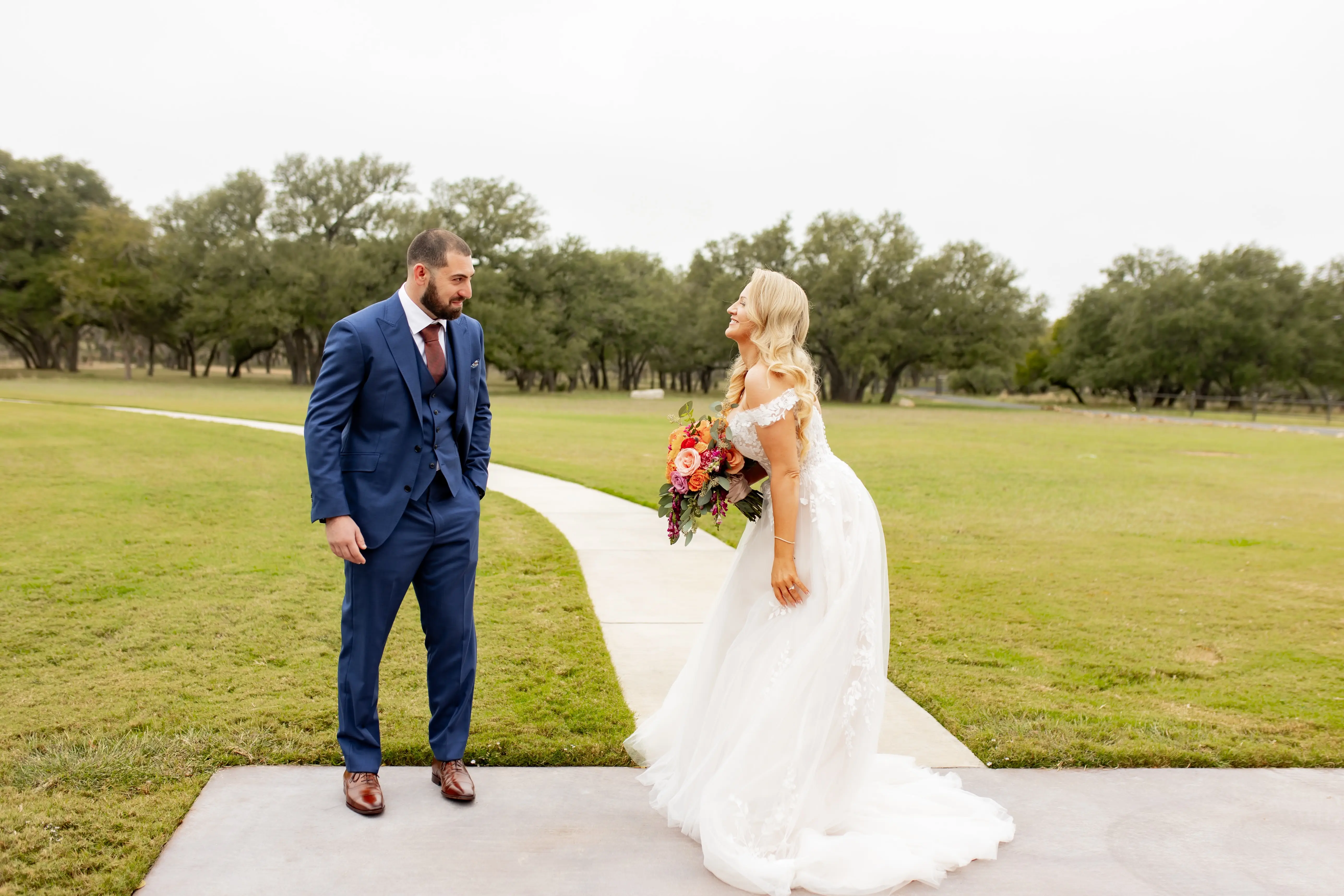 Bride wearing Harlem by Maggie Sottero with her husband
